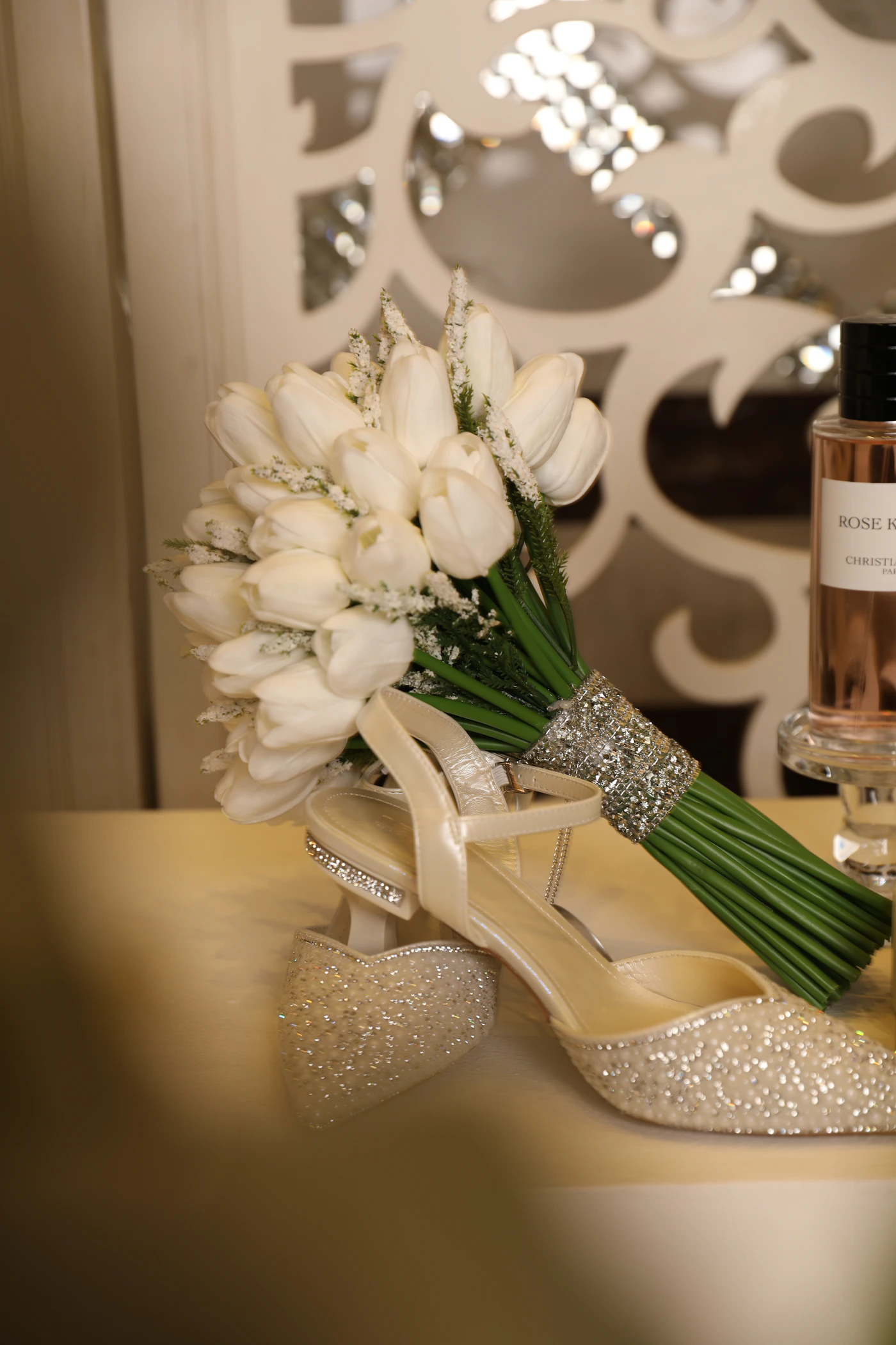 Bridal closet essentials for destination weddings — A collection of bridal accessories including comfortable flats, jewelry, and a veil laid out for packing.
