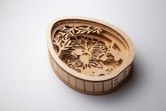 A wooden easter egg with a forest scene.