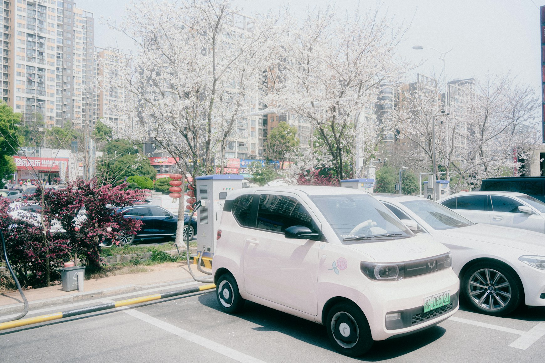 Commercial EV fleet vehicles charging at depot