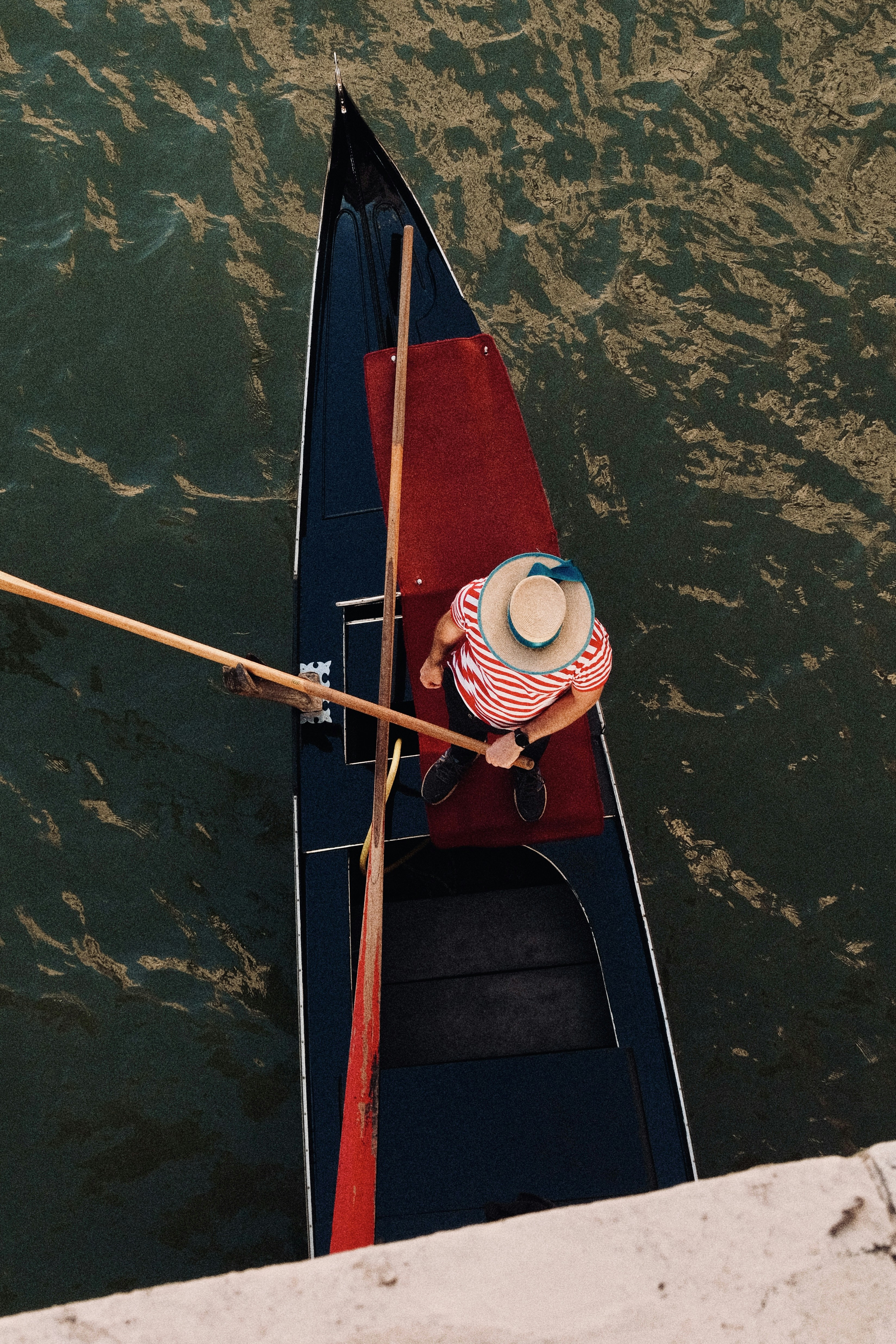 A gondolier rows his boat in venice.