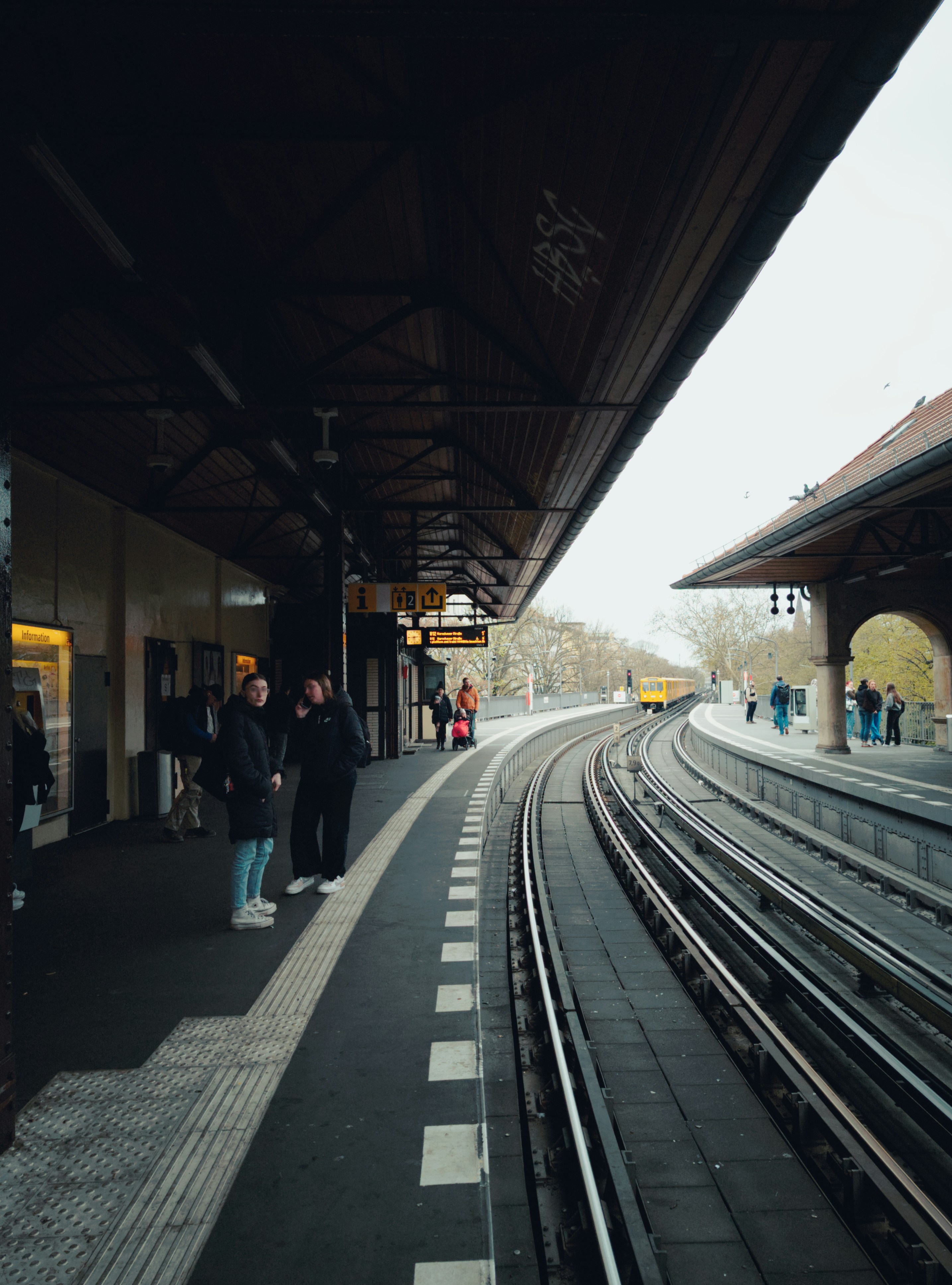 People wait for the train on the platform.