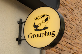 The sign reads "grouphug".