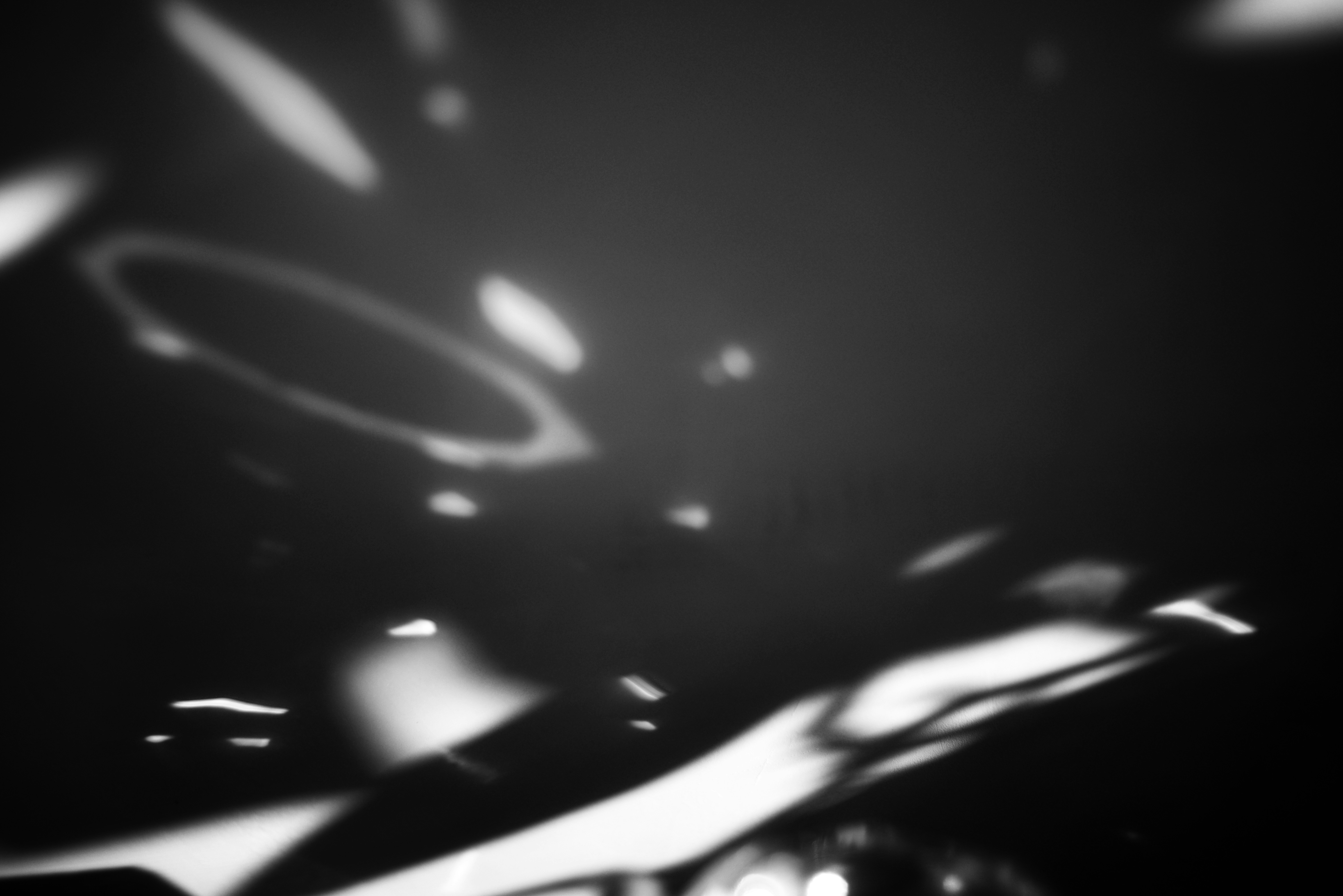 Water surface with light and shadows reflected.