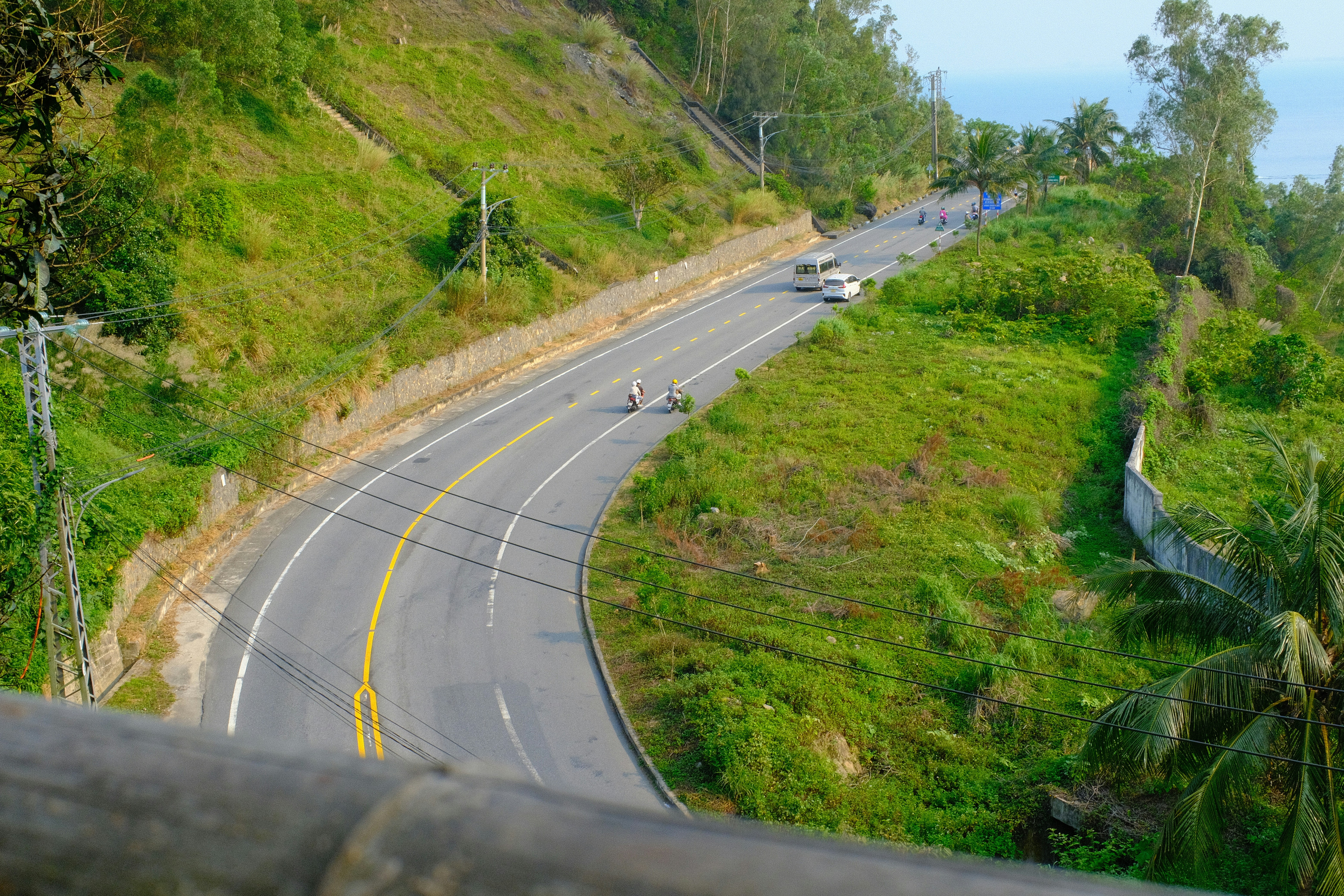 Winding road through lush green hills.
