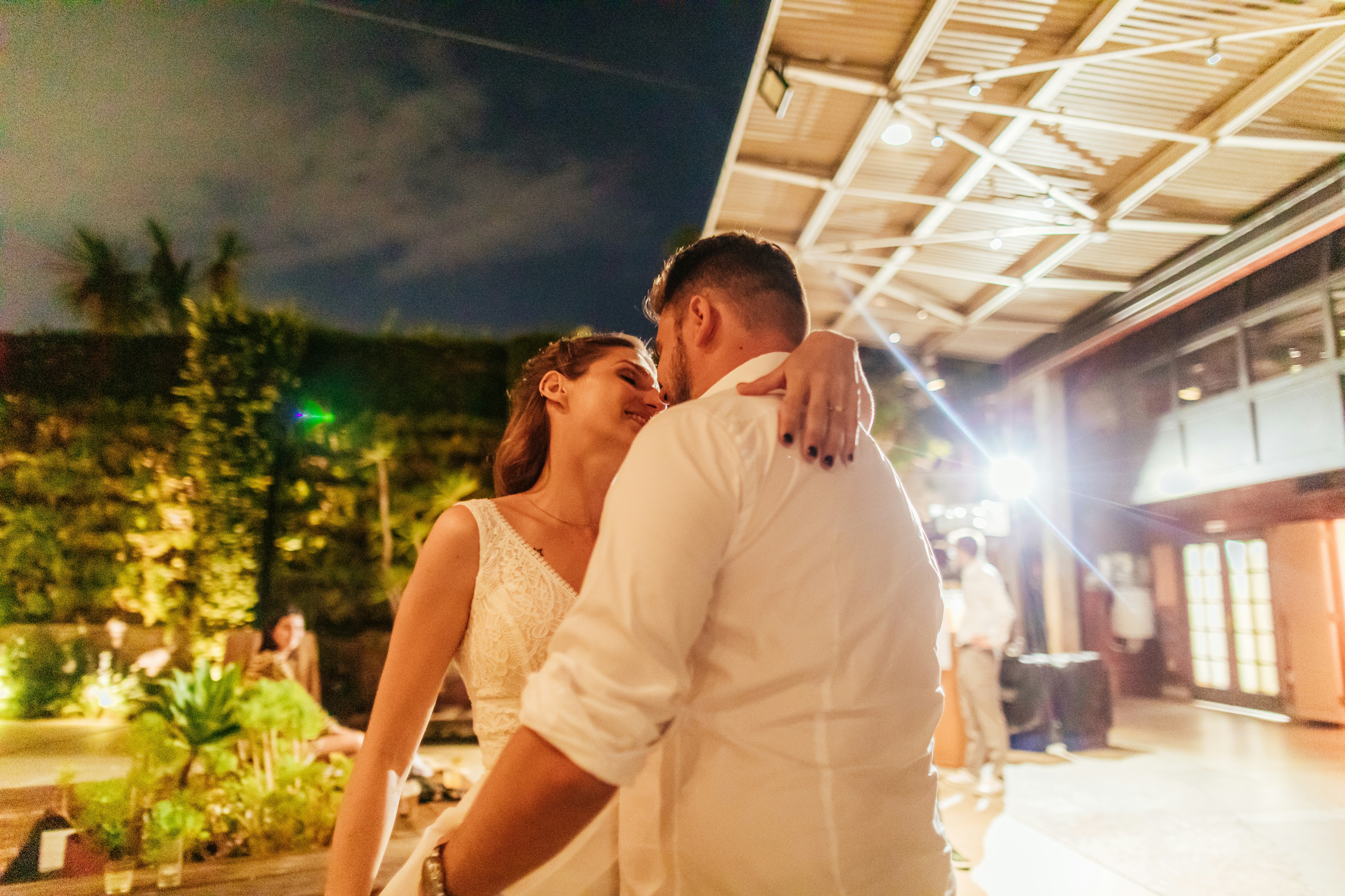 Couple shares a romantic dance at a reception.