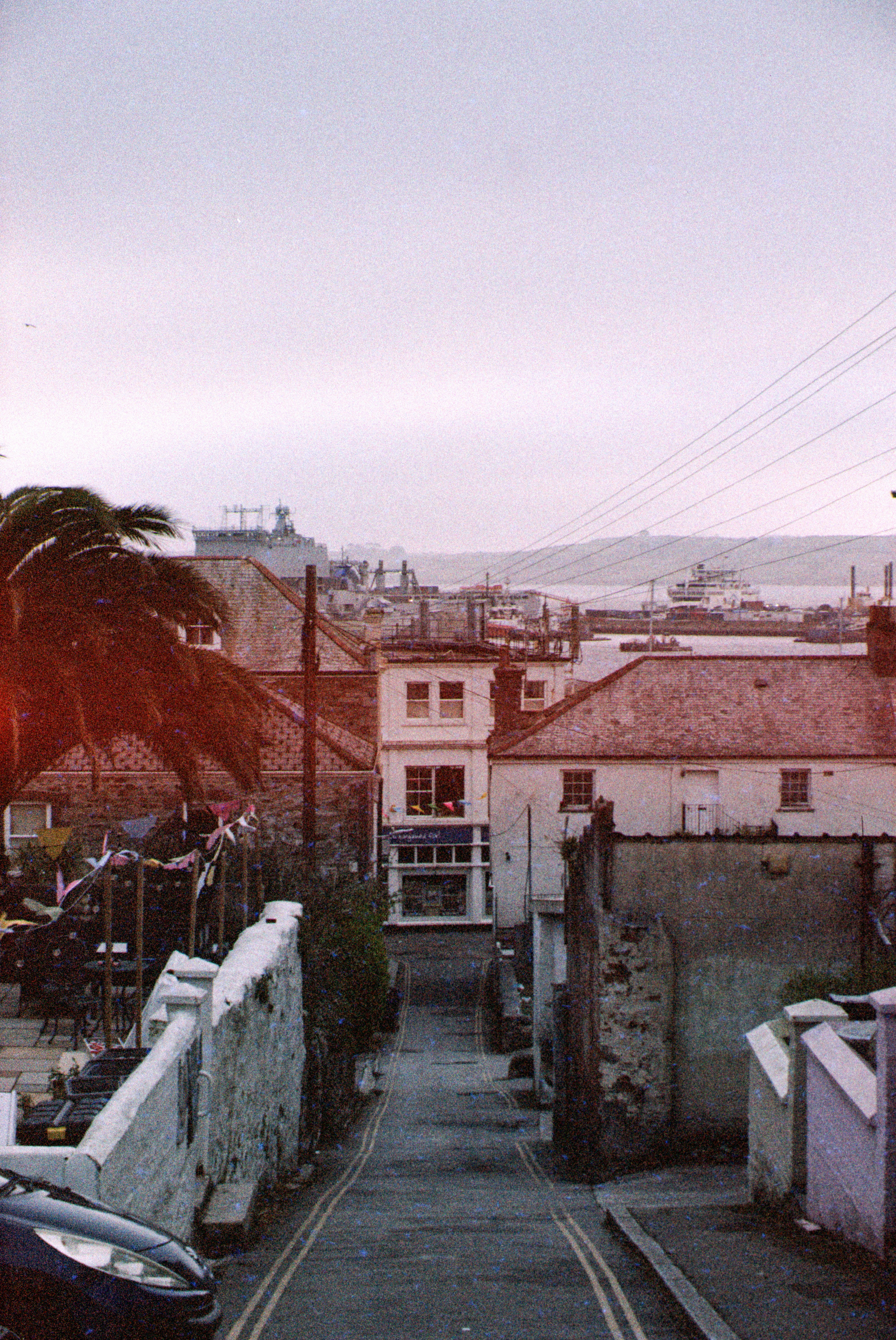 A winding street leads to a coastal town.
