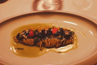 Artfully plated contemporary tasting-menu dish with delicate garnishes