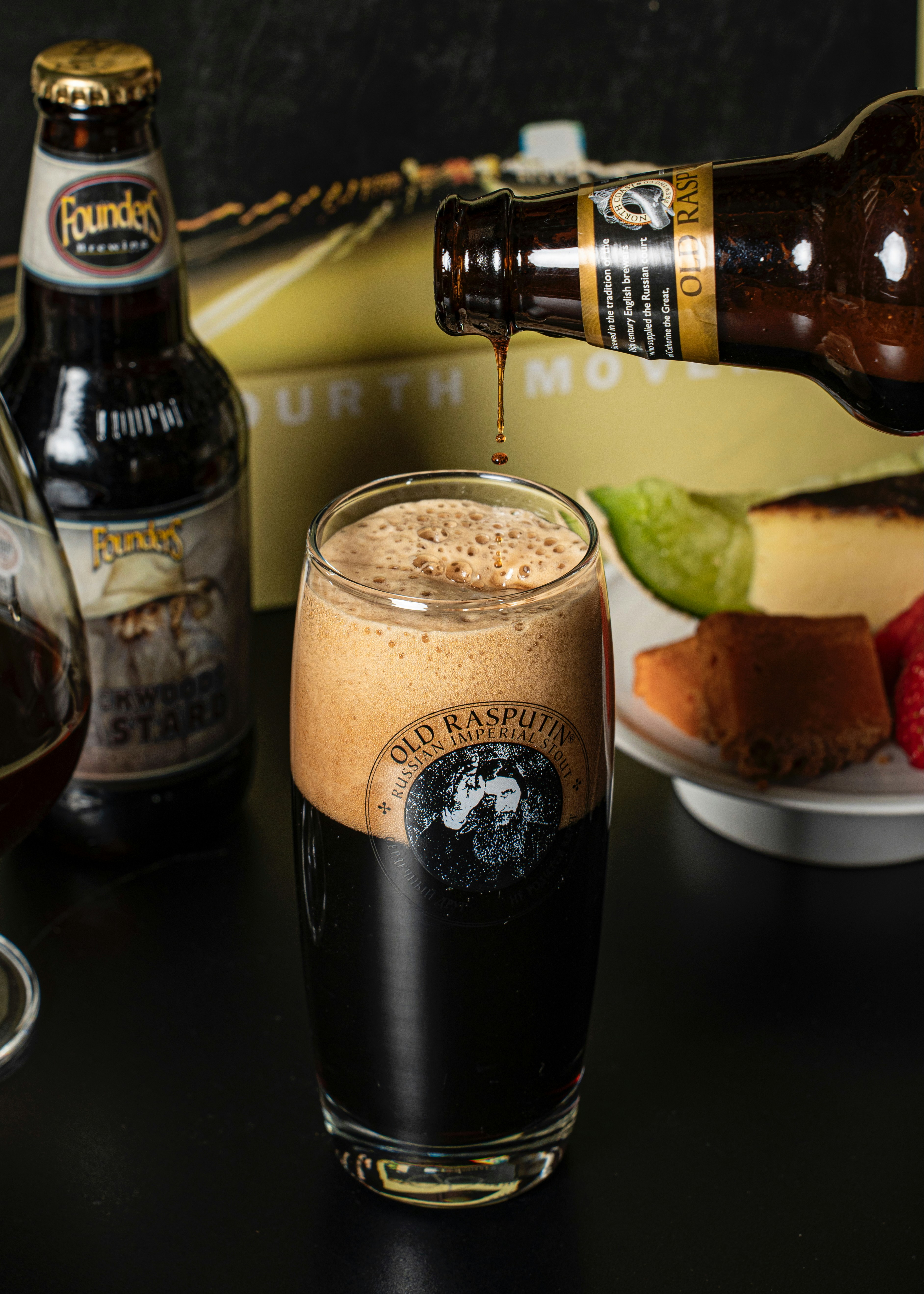 Beer is being poured into a pint glass.