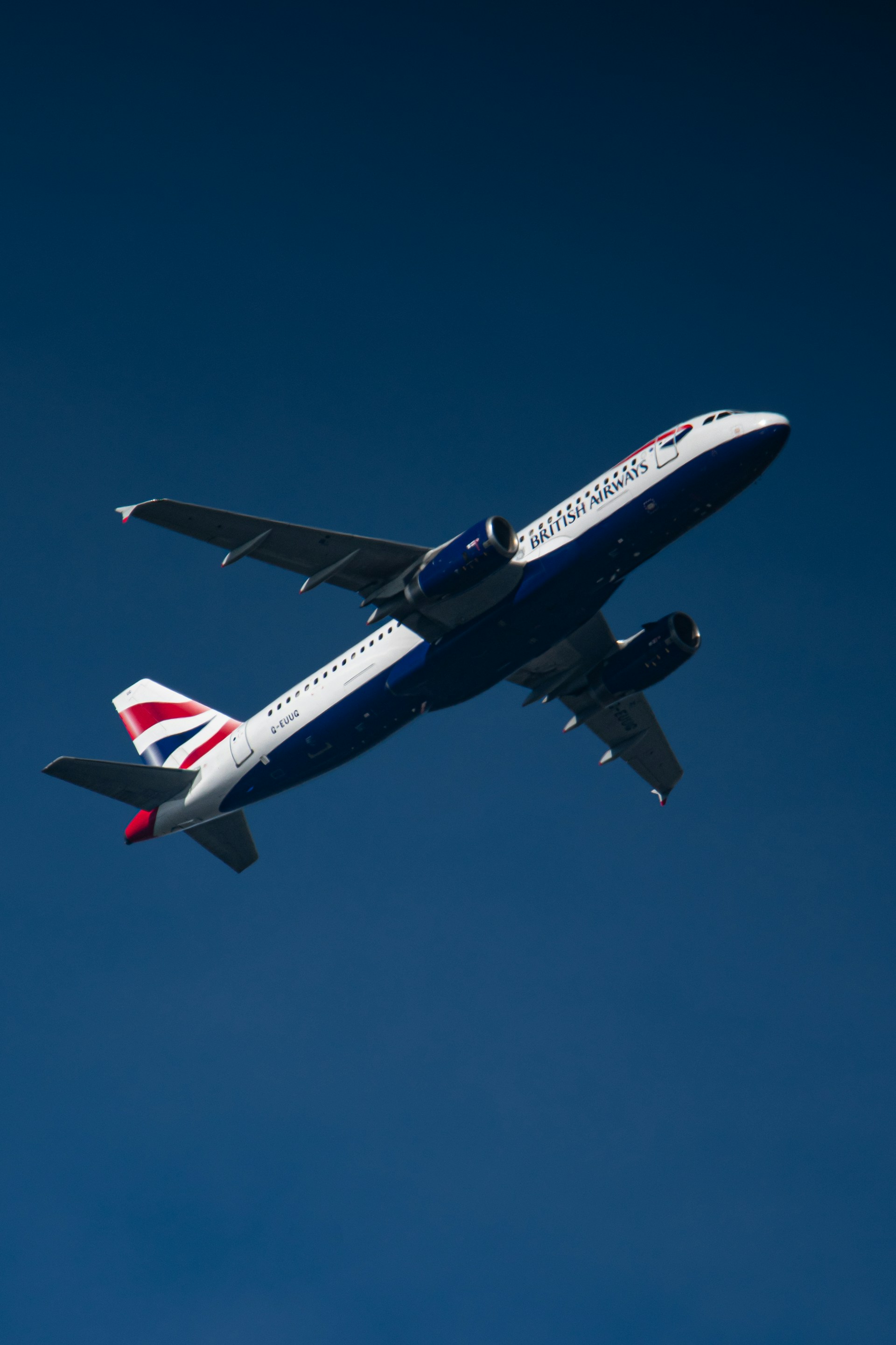 A british airways plane takes off into the sky.