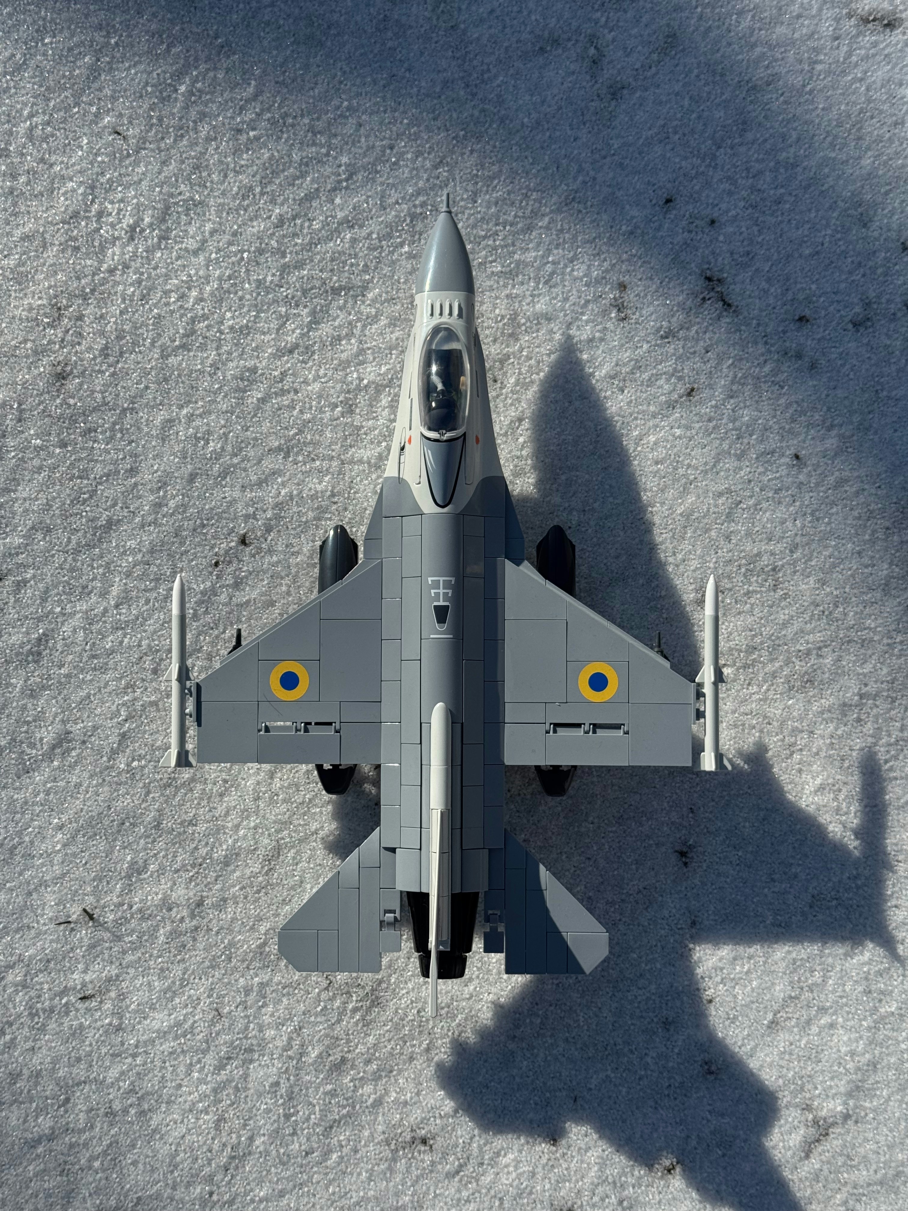 A model jet plane on a snowy ground.