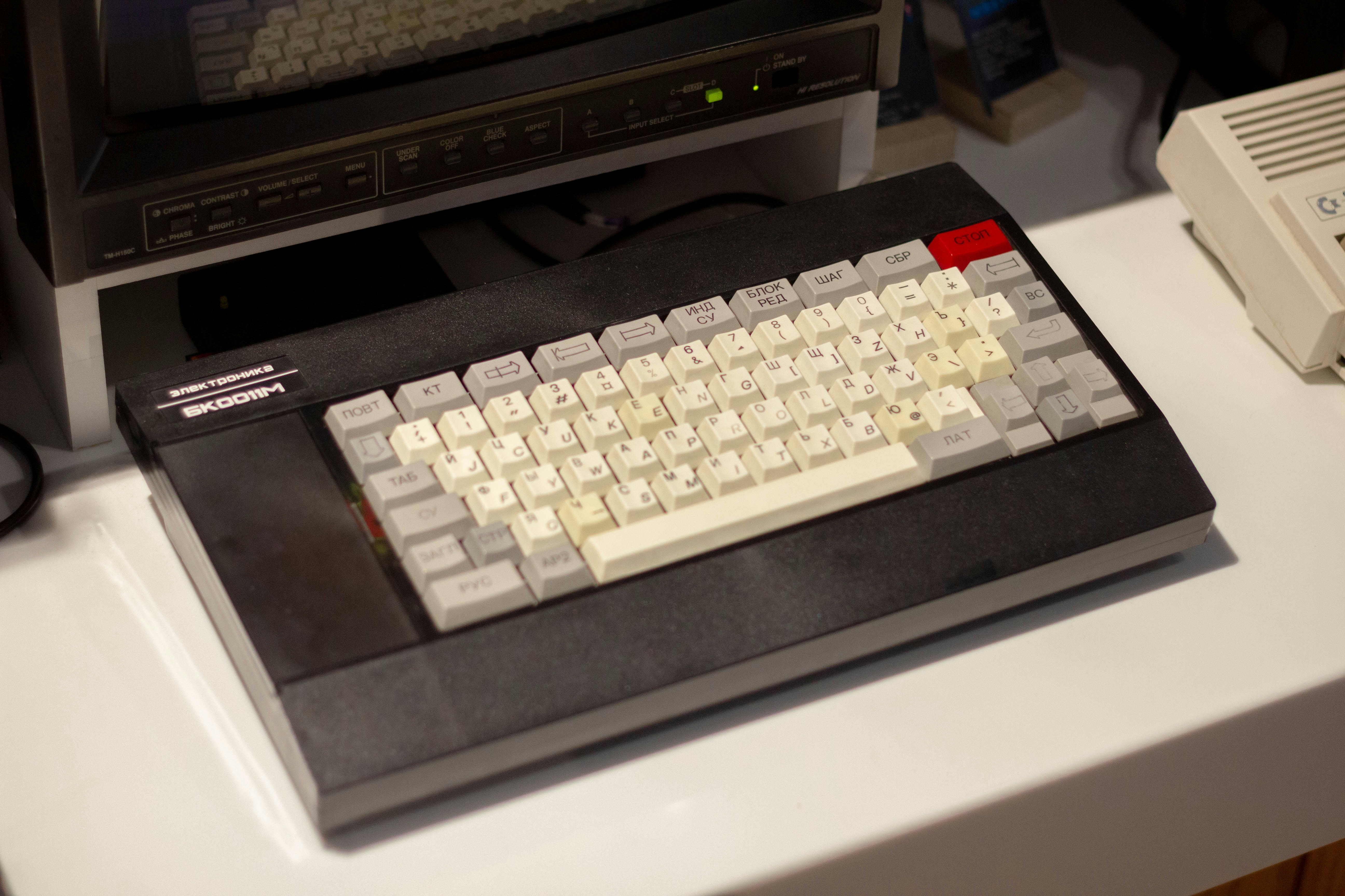 An old computer keyboard sits in the foreground.