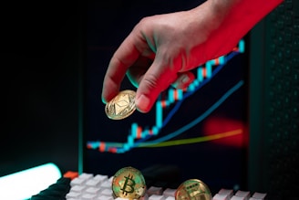 Hand holding ethereum with crypto graphs in background.