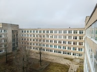 A large, grey building on a cloudy day.