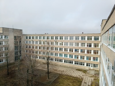 A large, grey building on a cloudy day.