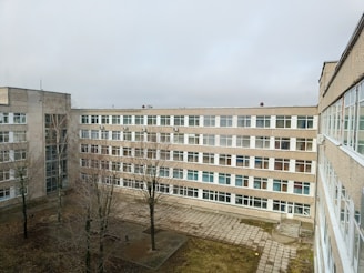 A large, grey building on a cloudy day.