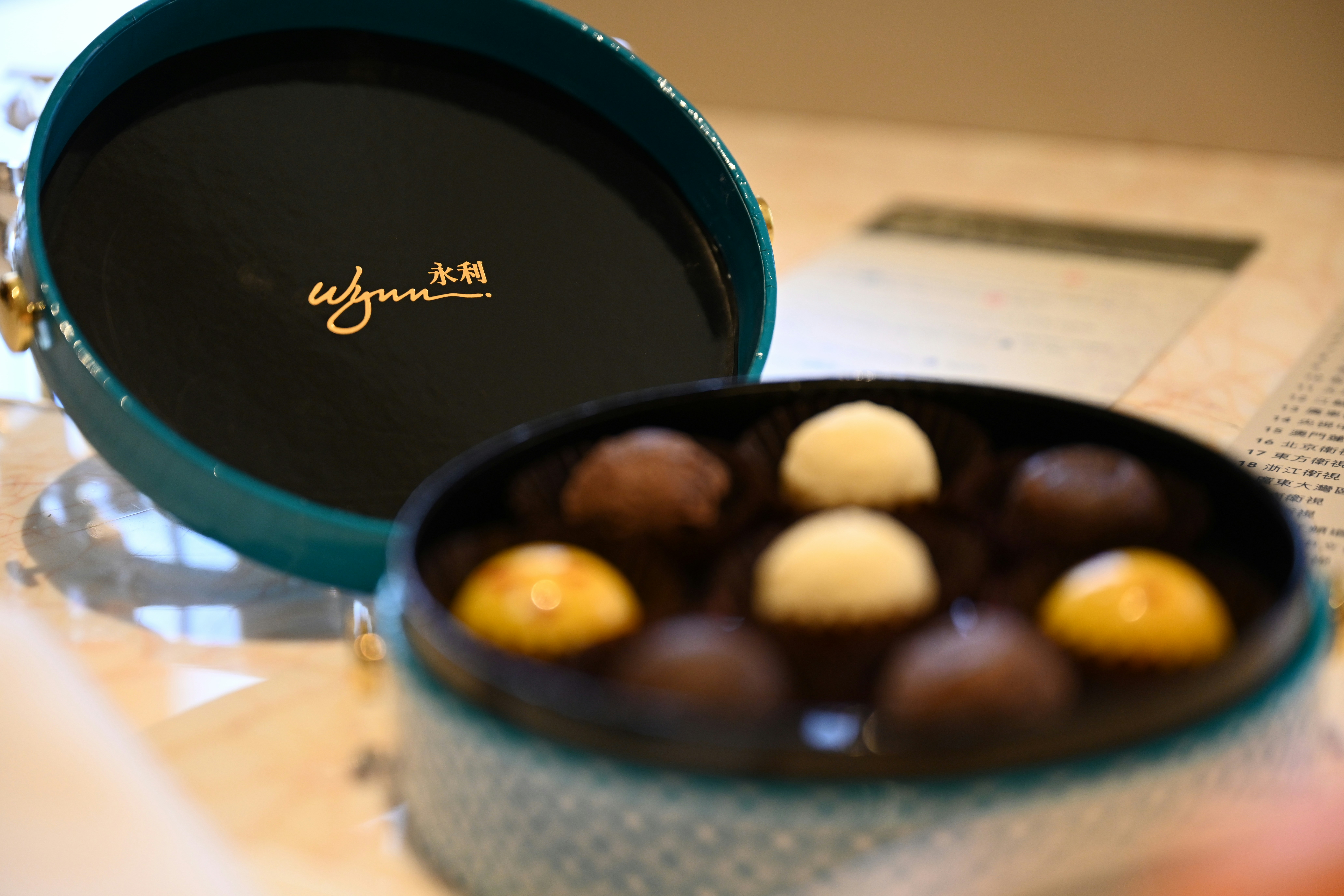 A box of delicious chocolates is open.