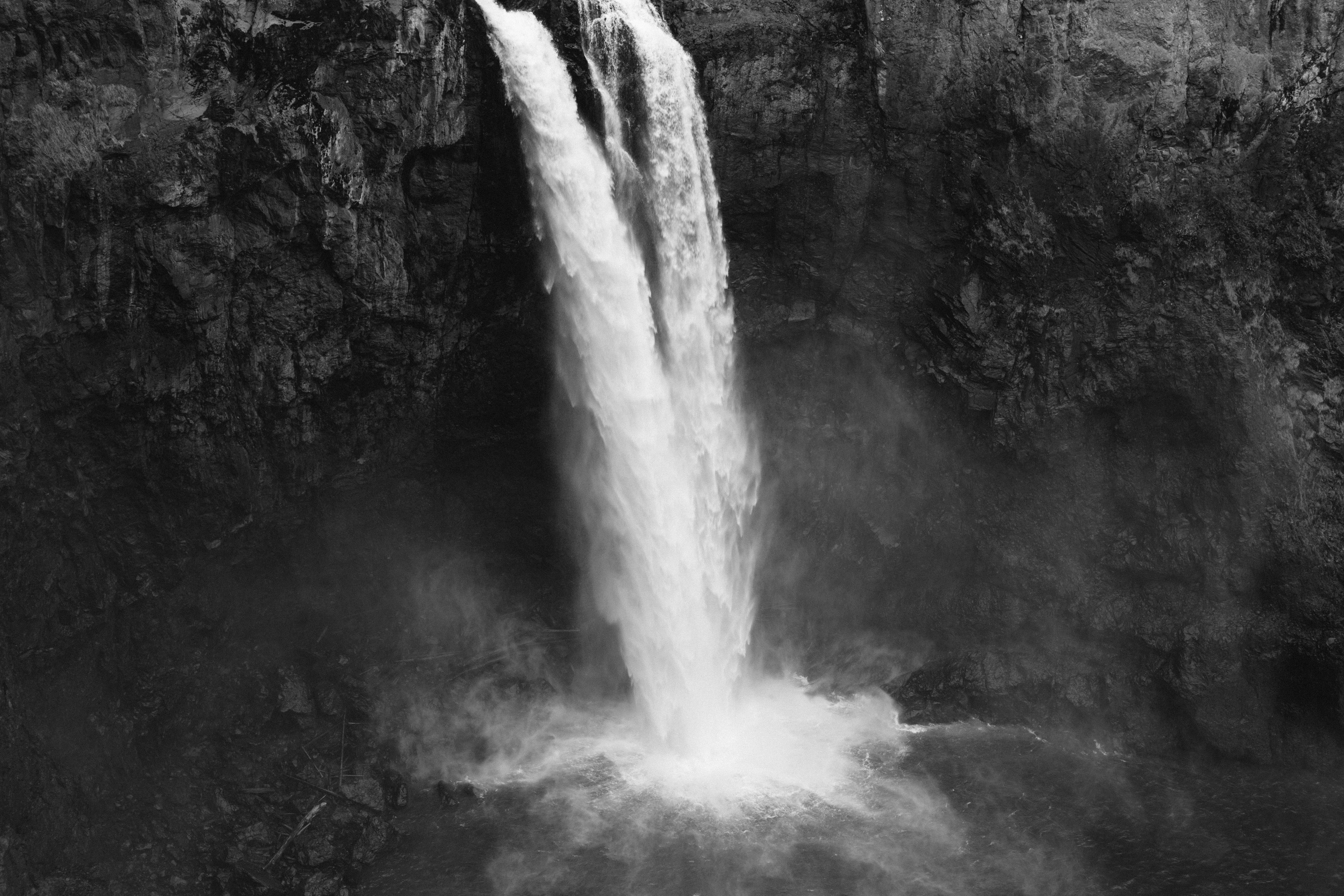 A majestic waterfall cascades down a rocky cliff.