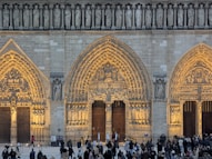 The notre dame cathedral's beautiful facade is shown.