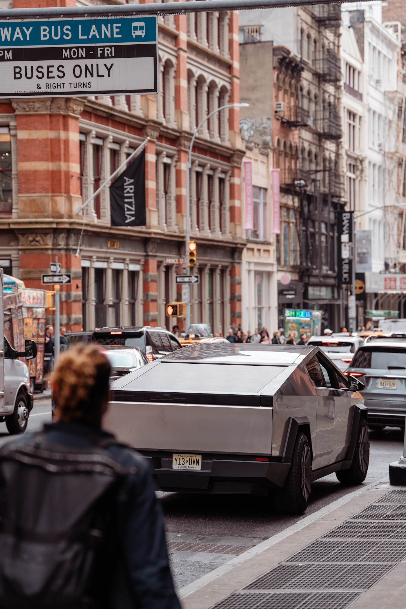 Tesla Cybertruck driving down a city street