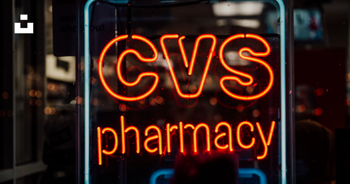 A neon cvs pharmacy sign glows at night. photo – Free Drugs Image on ...