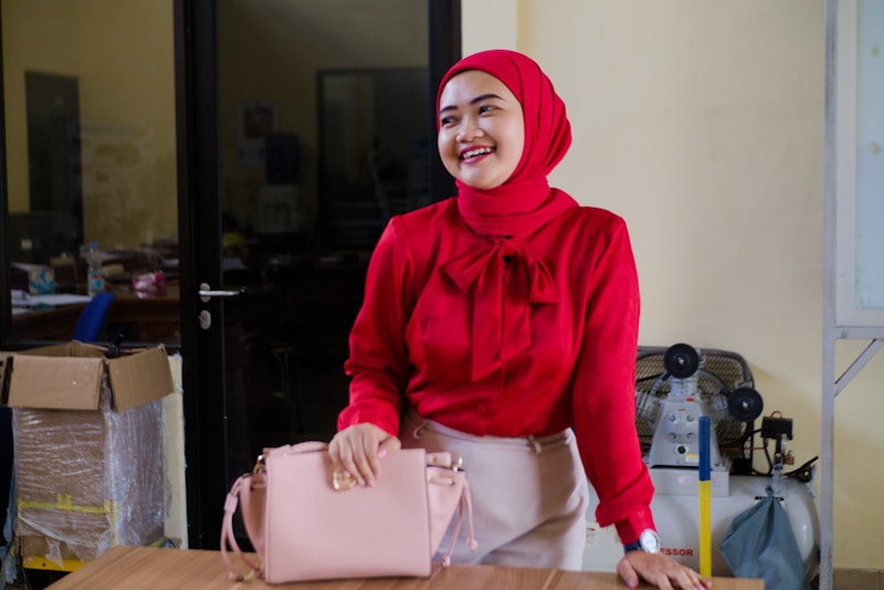 Elegant woman in red with luxury handbag