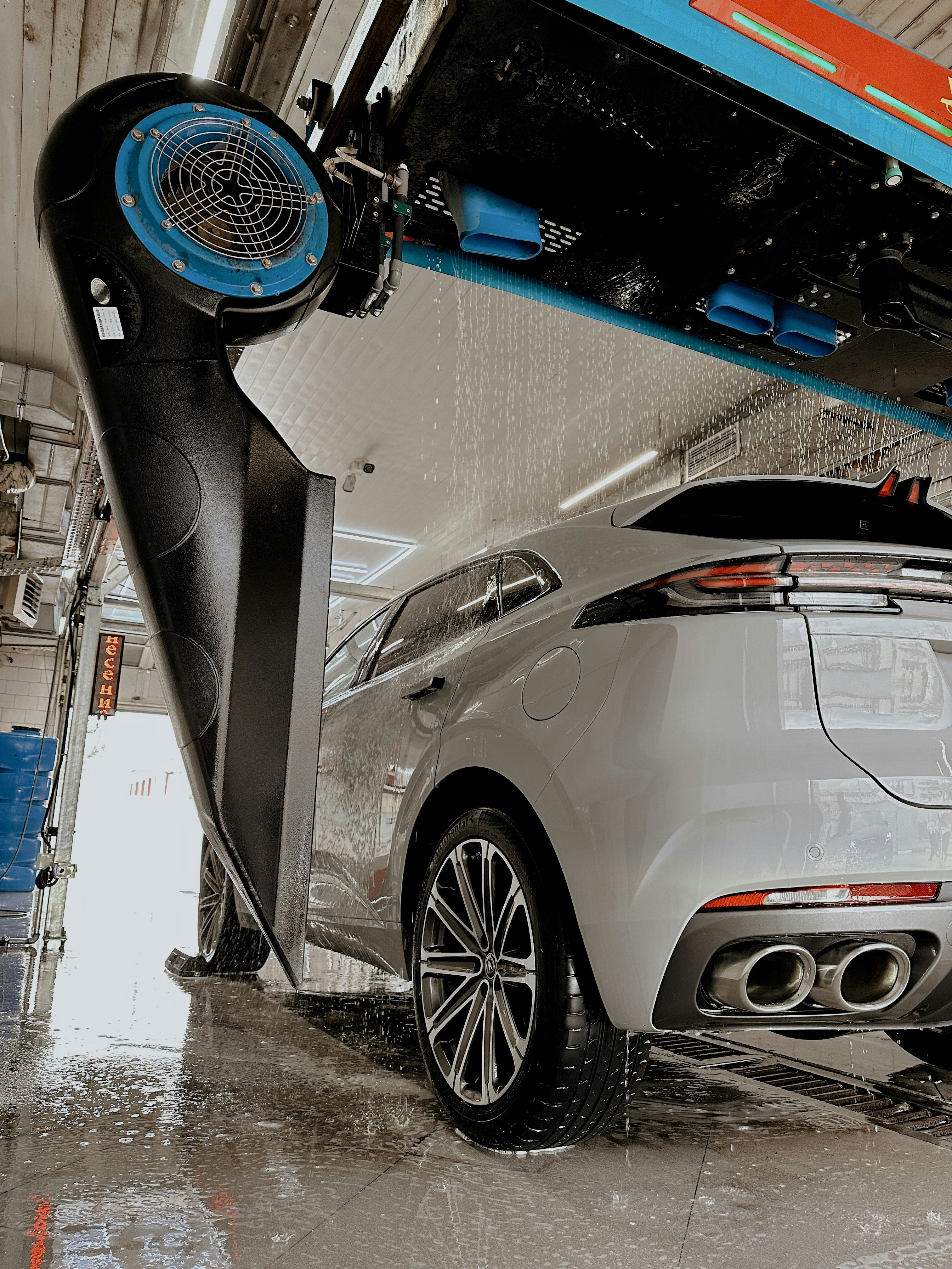 A car is being washed at a car wash.