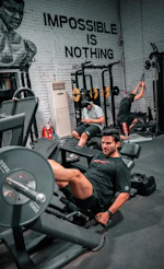 A man is working out at the gym.