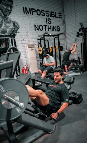 A man is working out at the gym.