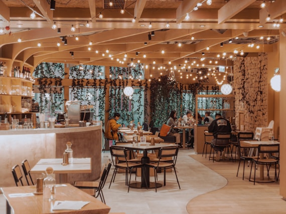 A cozy restaurant interior with string lights.