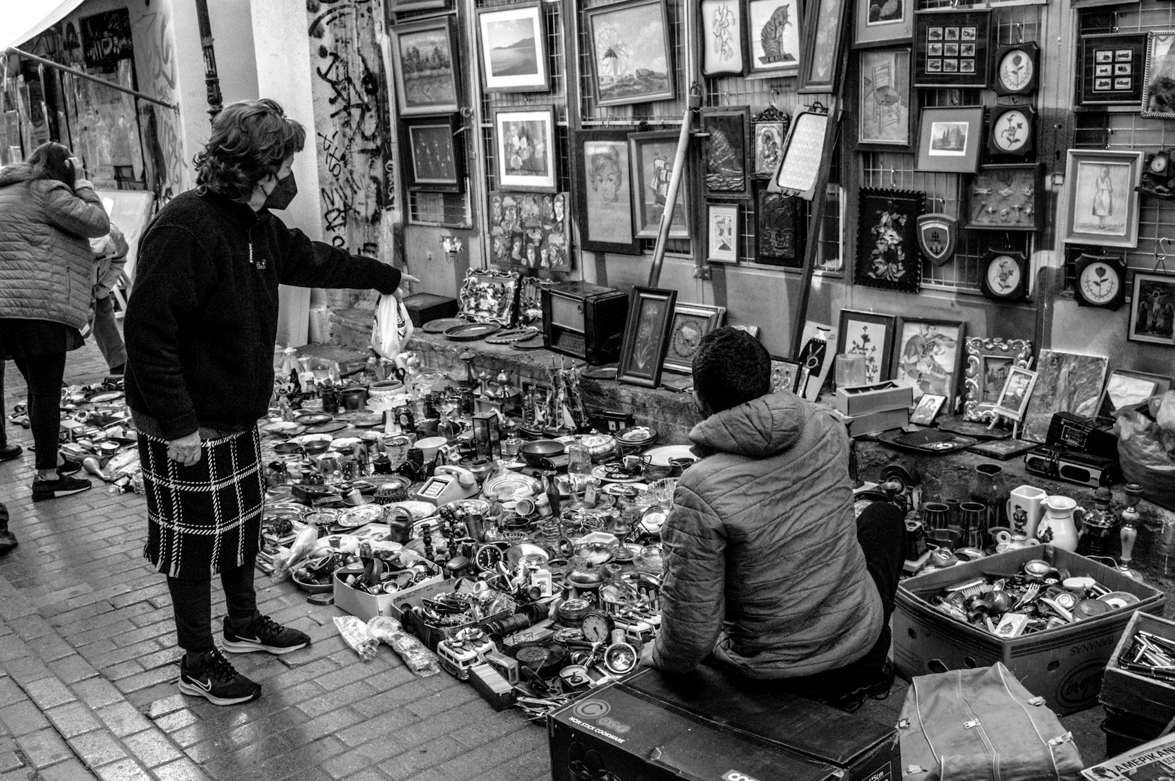 People browsing stalls in Athens' Monastiraki flea market