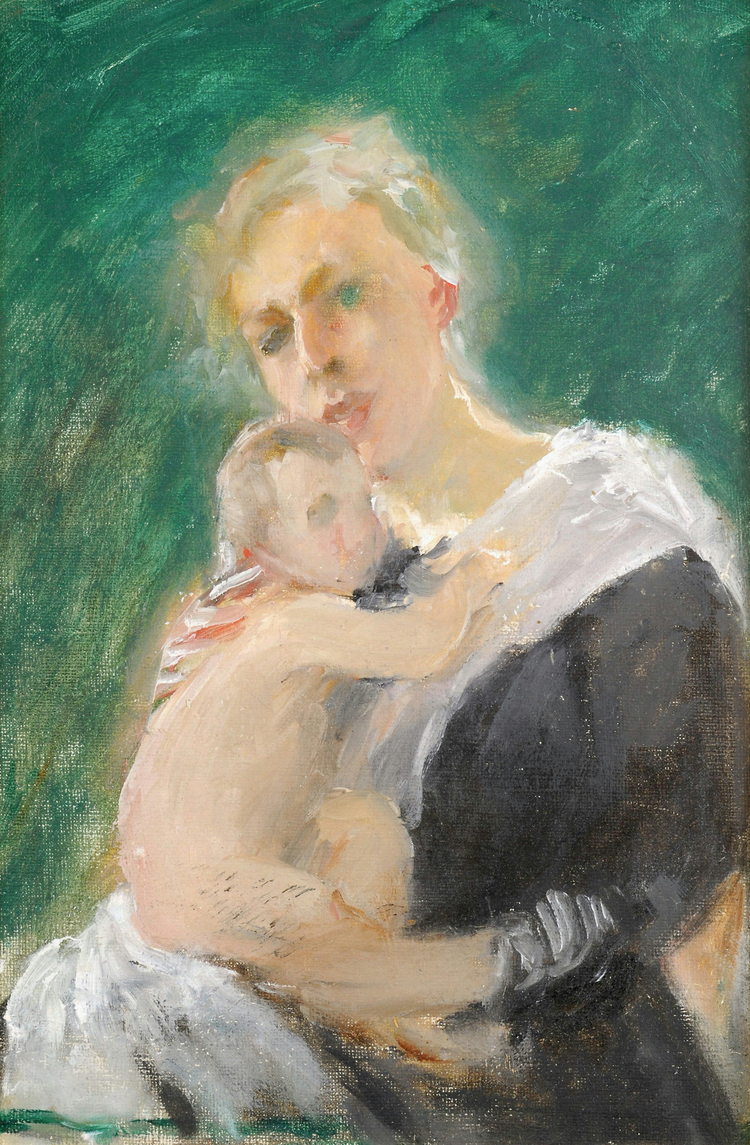 Mother holding her baby with a green background