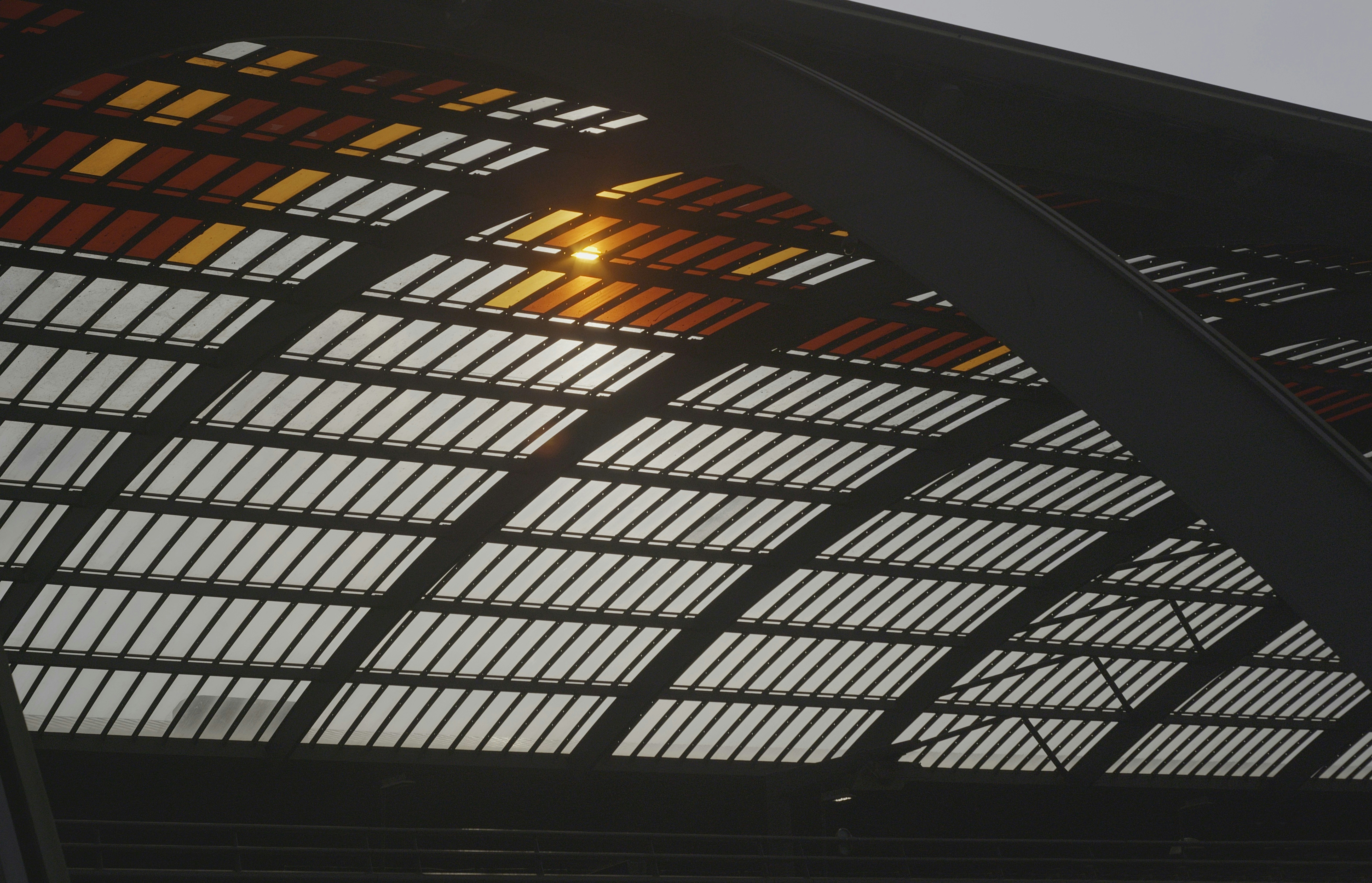 The arched roof allows sunlight to pass through., Amsterdam Centraal train station, Netherlands