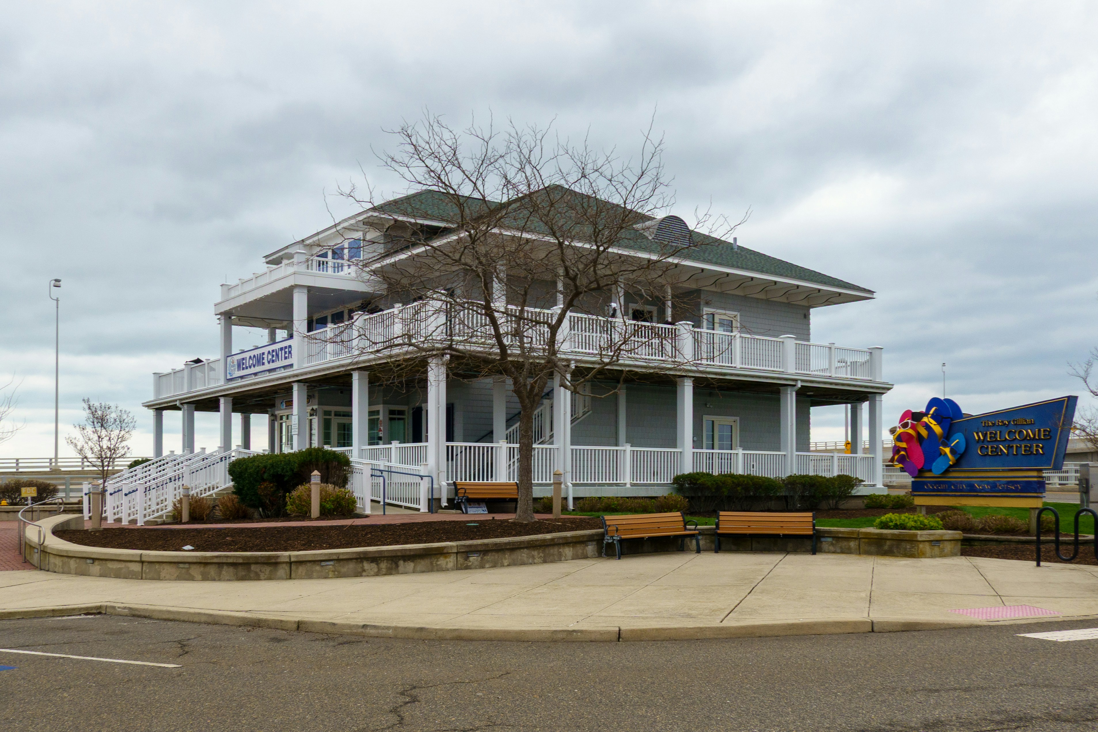 A two-story building is shown on a cloudy day.