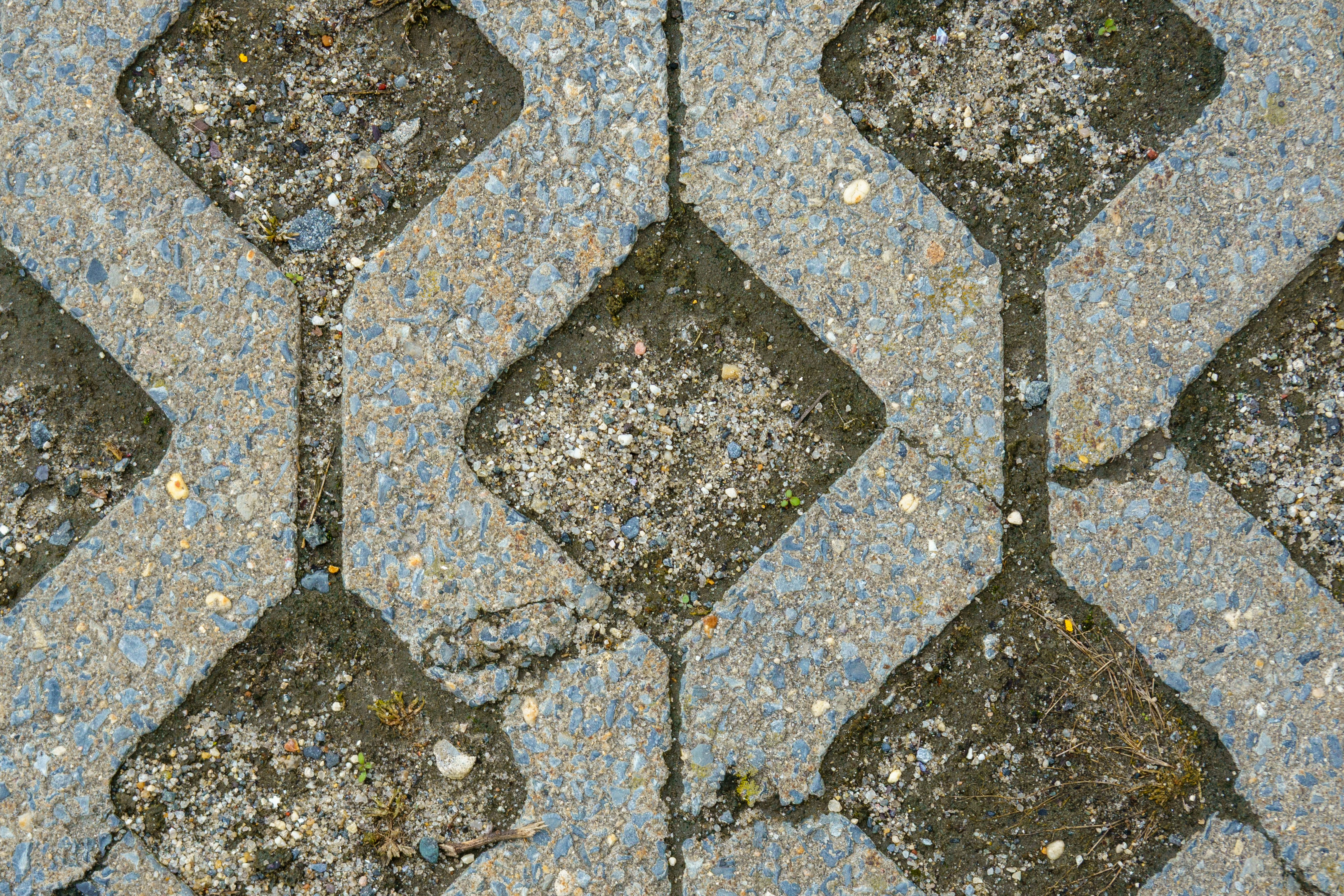 Concrete pavers with diamond-shaped voids.
