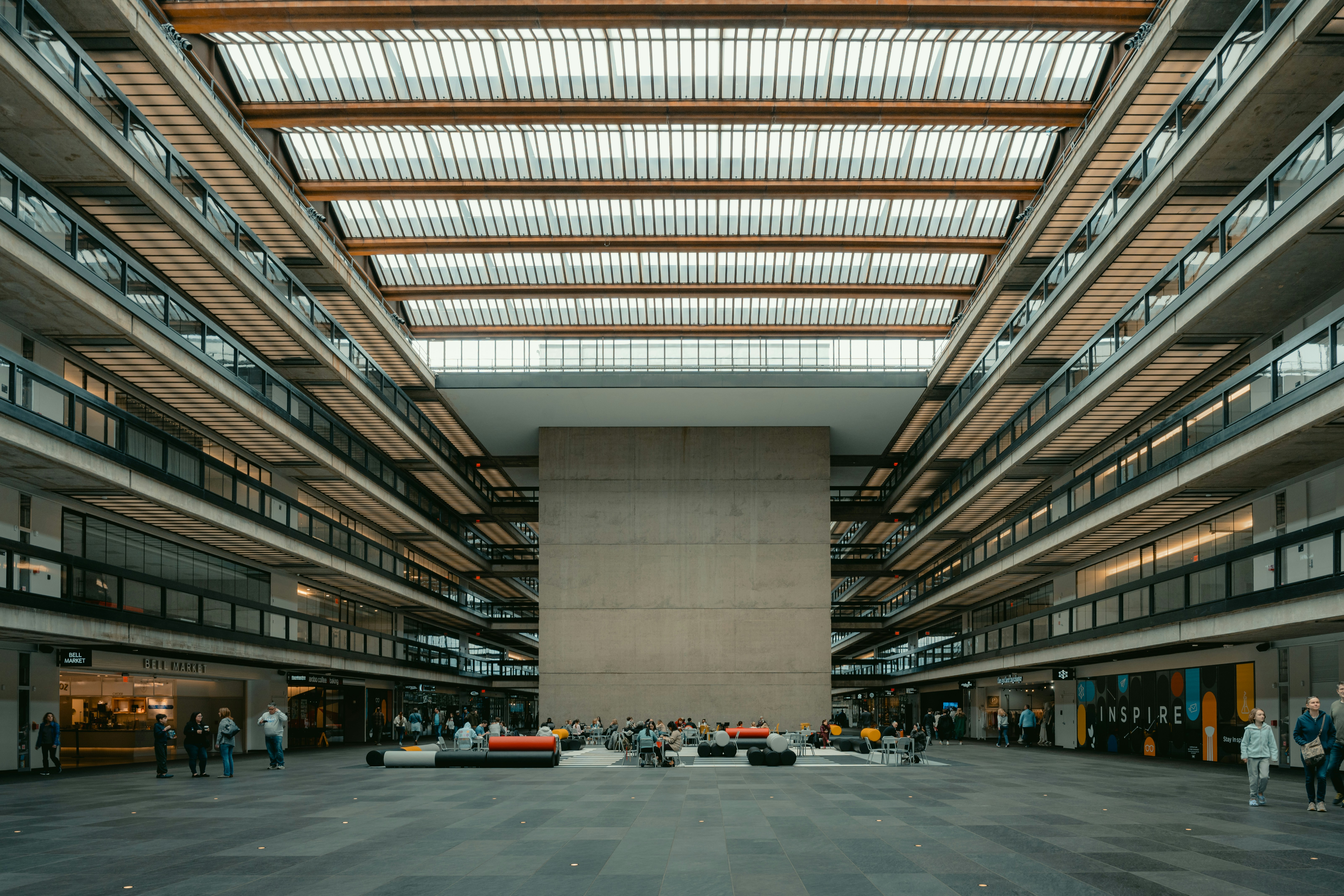 An expansive building interior with a glass ceiling.