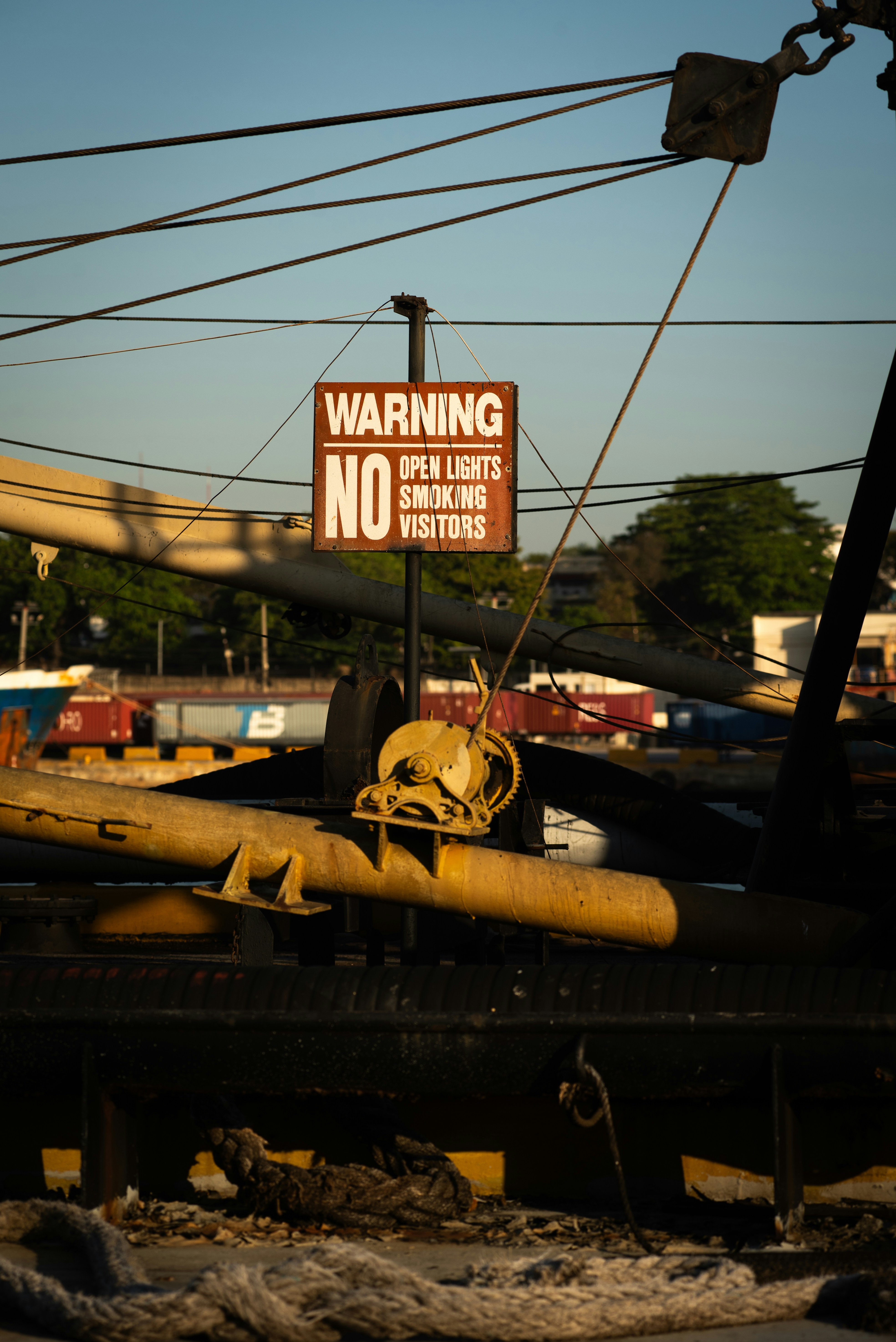 A "no" sign warns of open lights, smoking, and visitors.