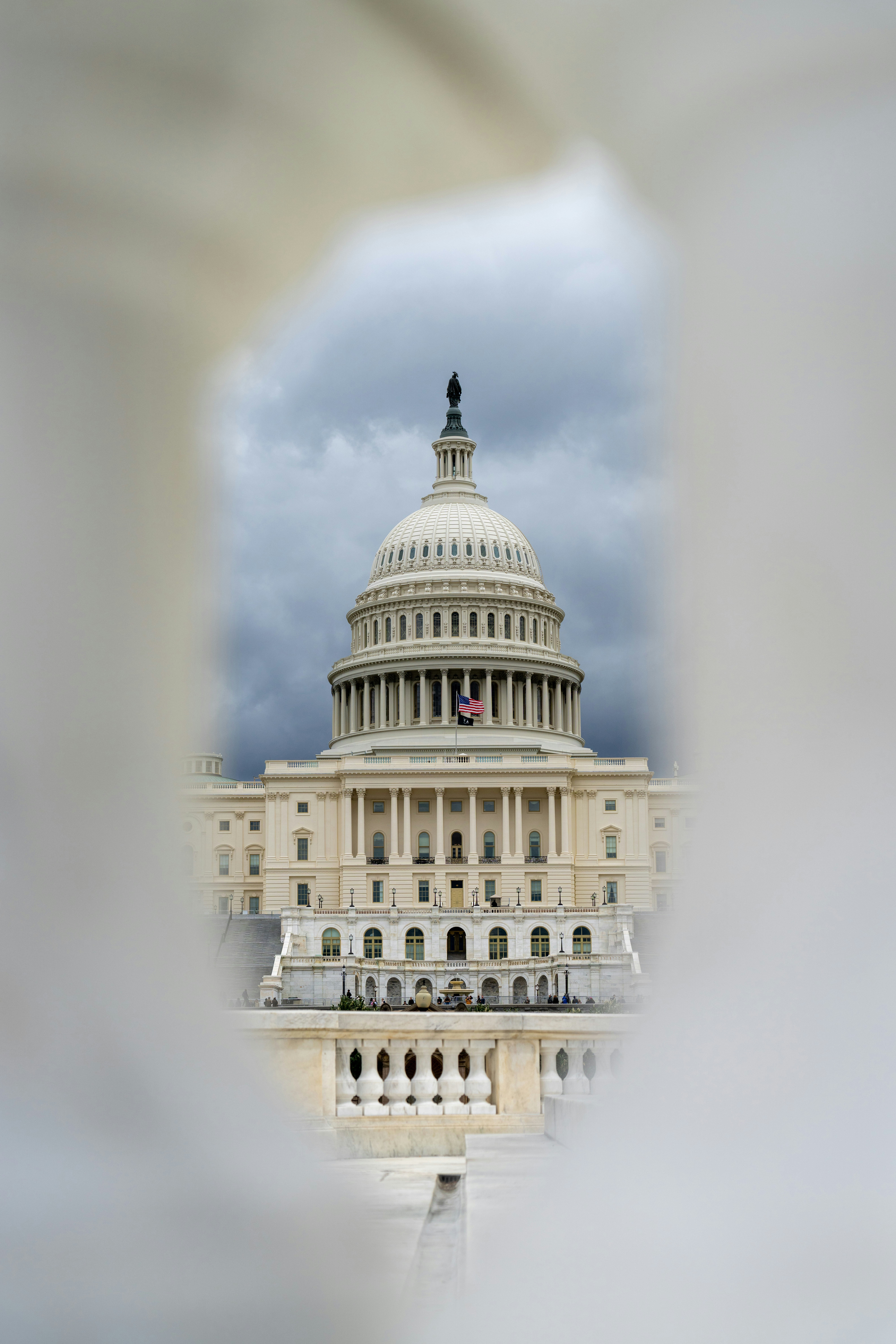 The u.s. capitol building is framed by a structure.