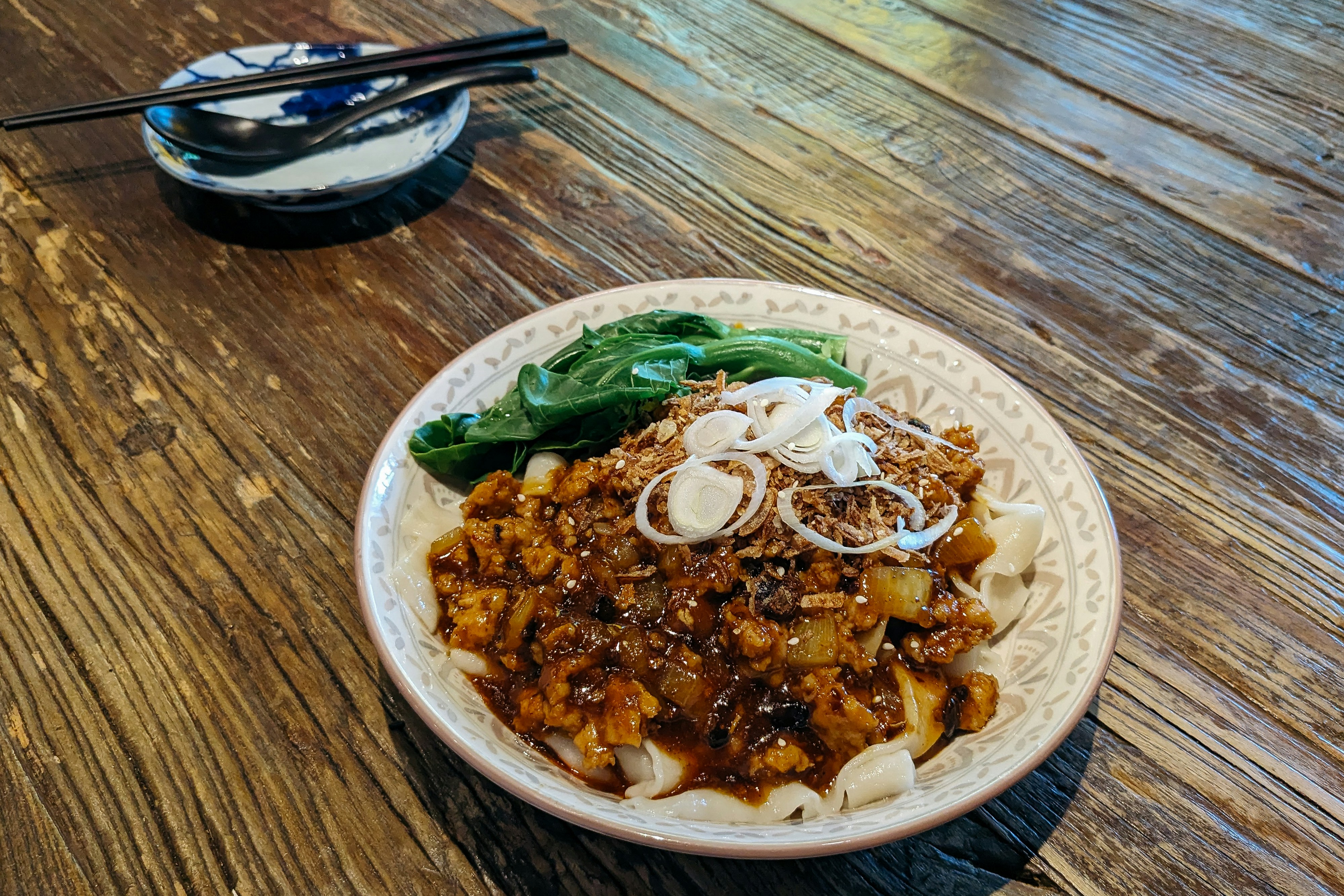 Black bean noodles with toppings