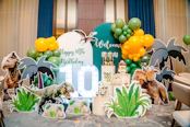 Dinosaur-themed birthday party decorations with balloons