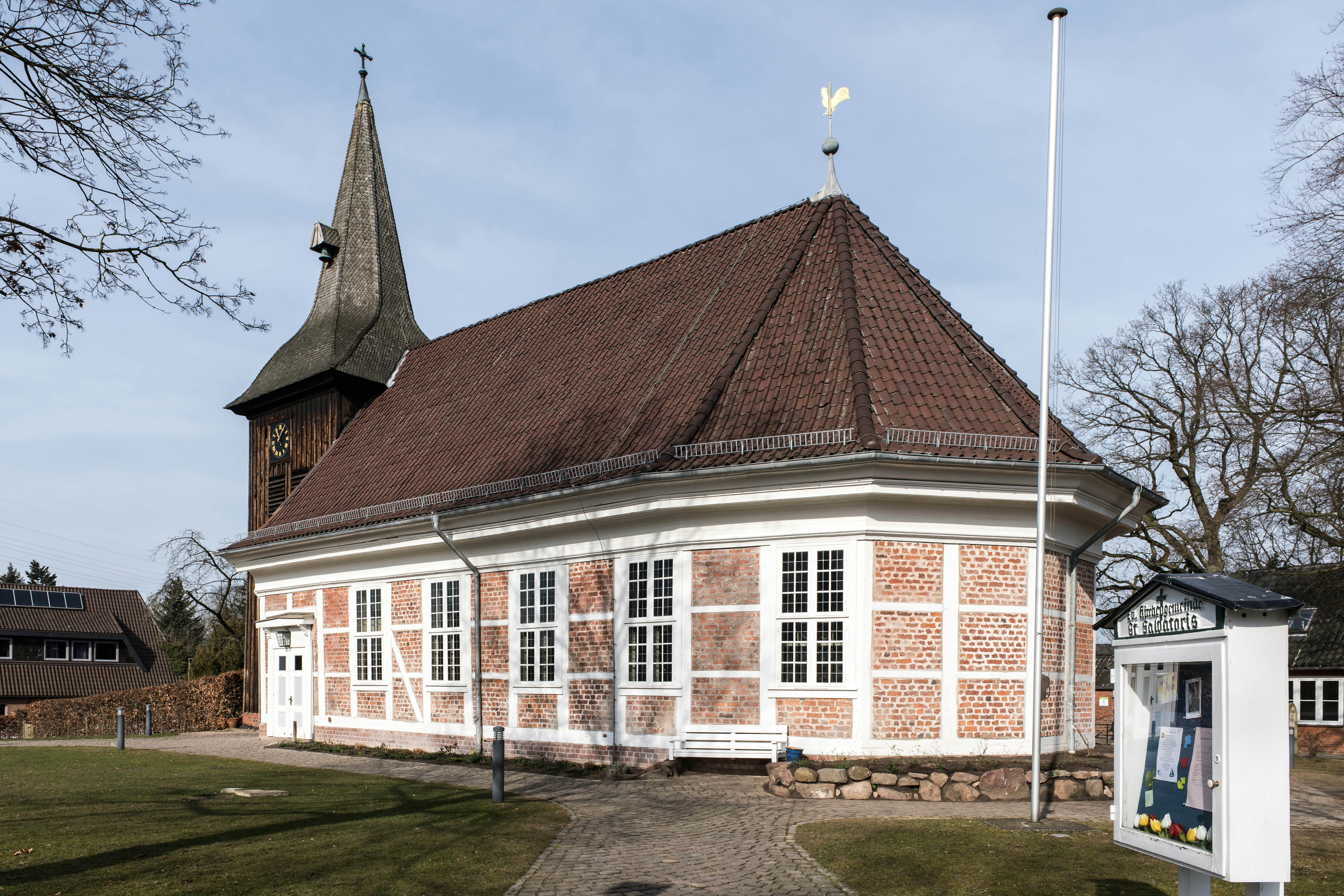 A church with a brick and timber facade.