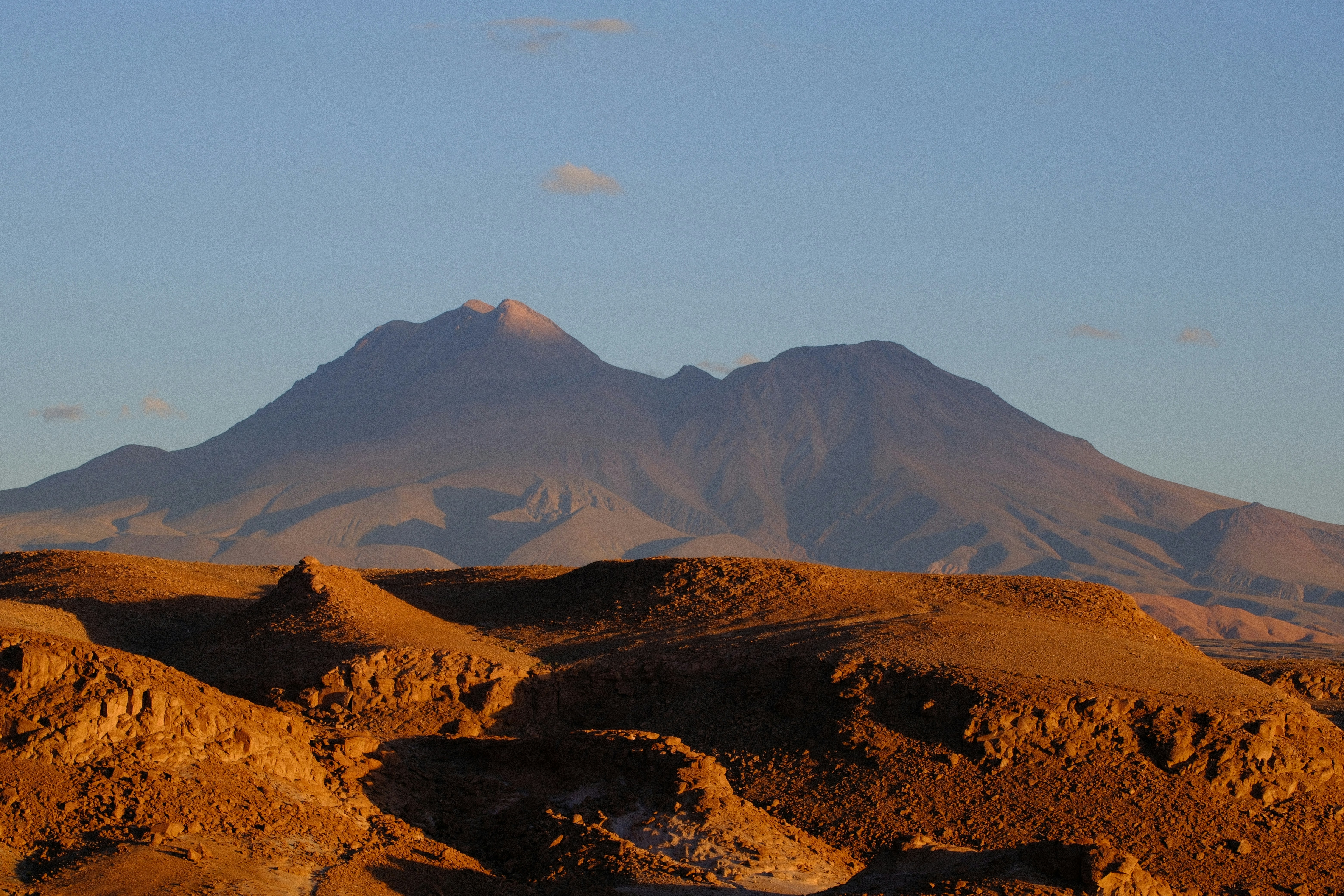 Mountains in the distance under a clear blue sky.
