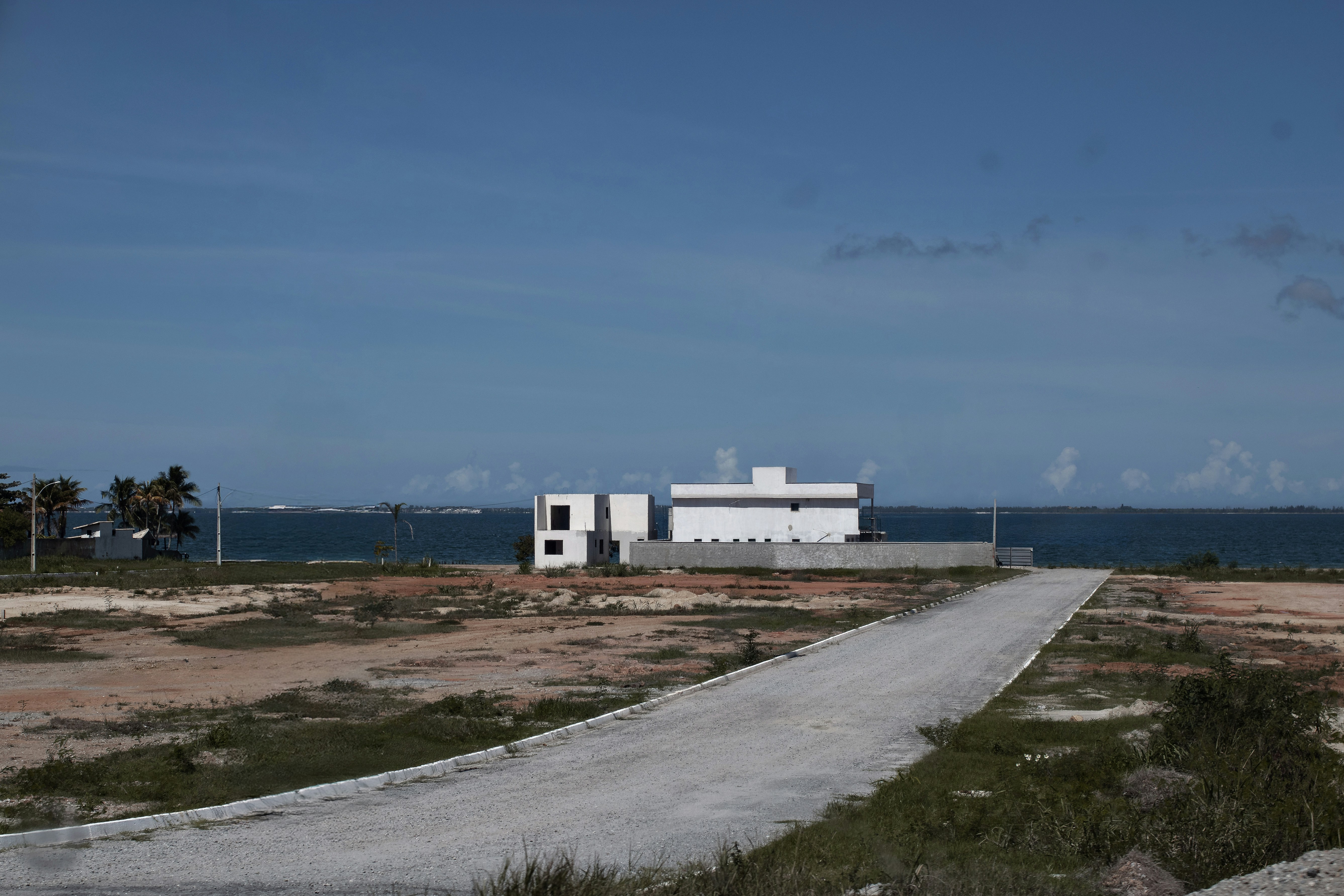 A lonely house sits near the ocean.