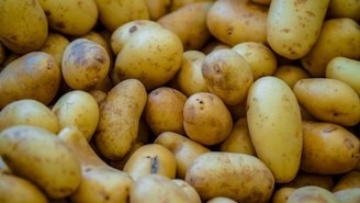 Here's a caption: potatoes galore, ready for cooking.
