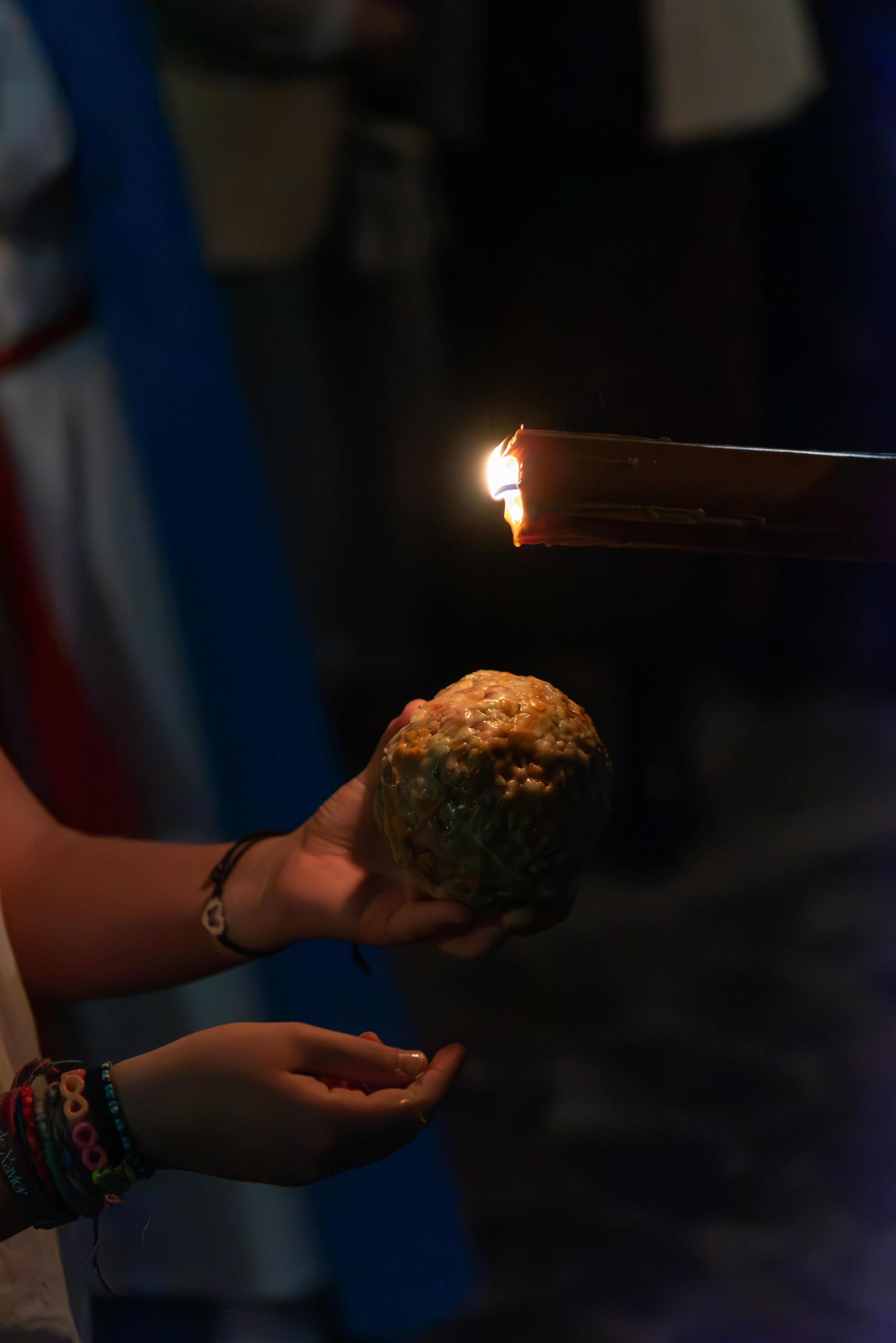 A person is lighting something with a torch.