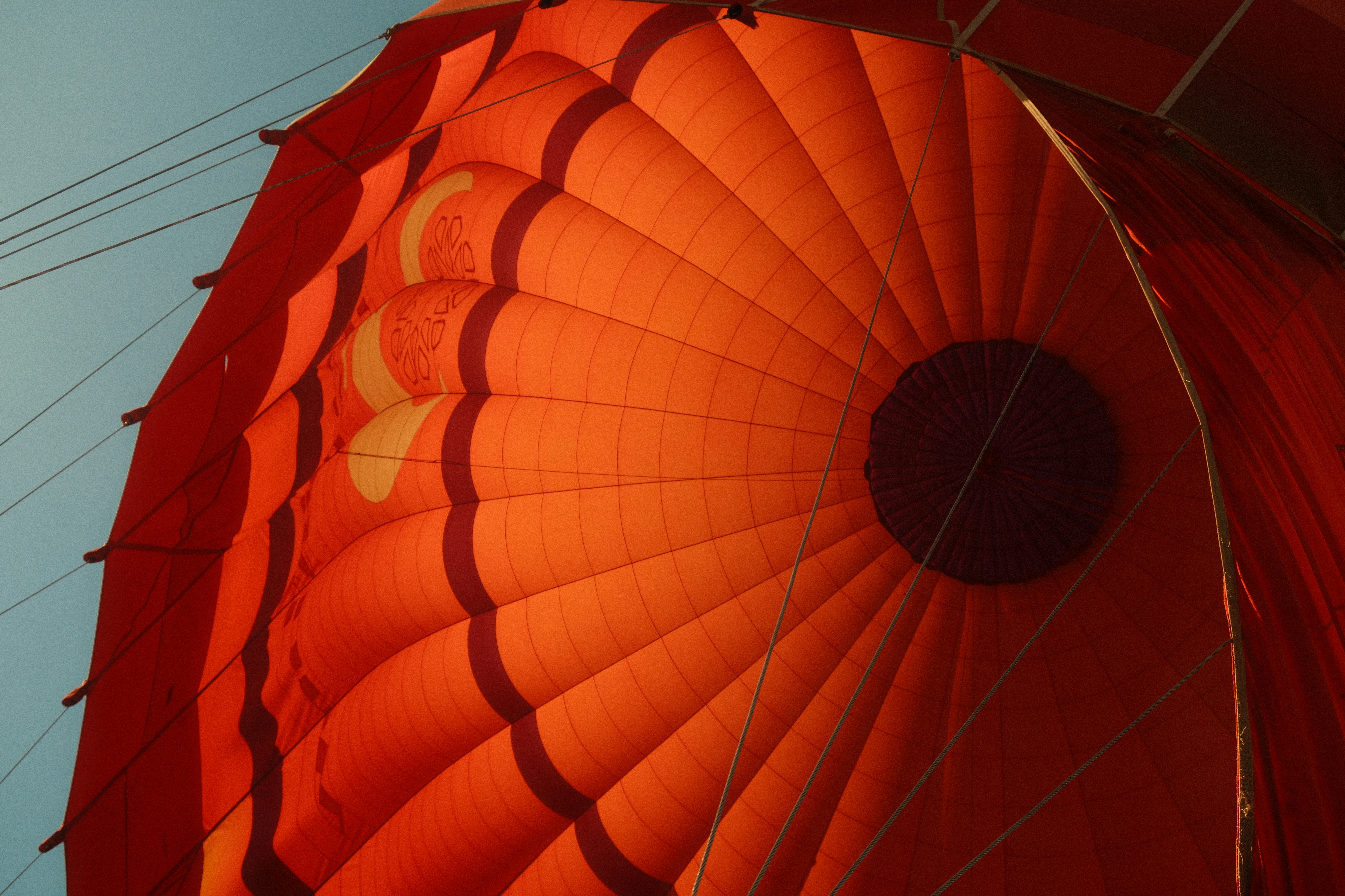 Inside a hot air balloon, looking upwards.