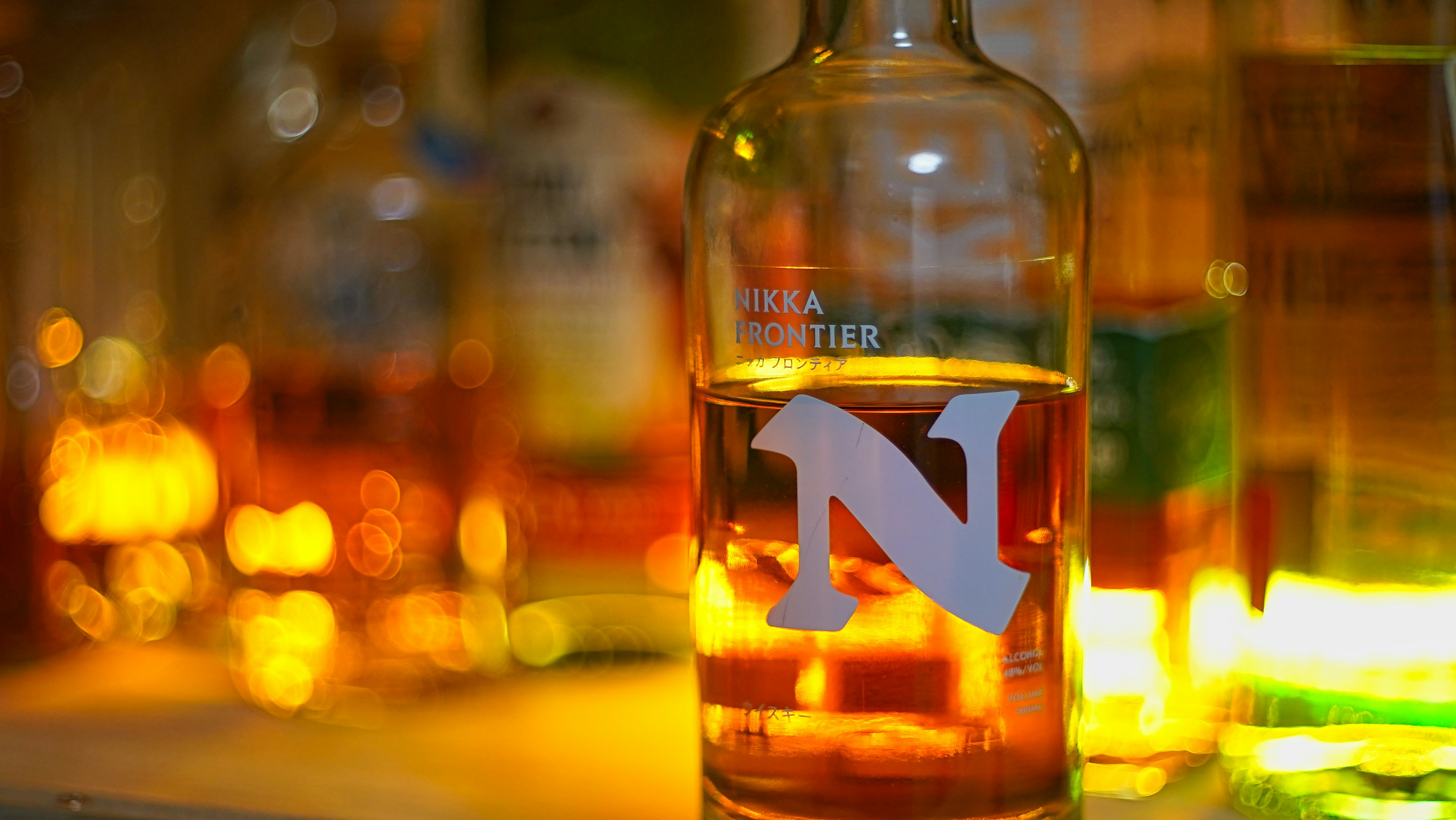 A bottle of liquor sits on display.