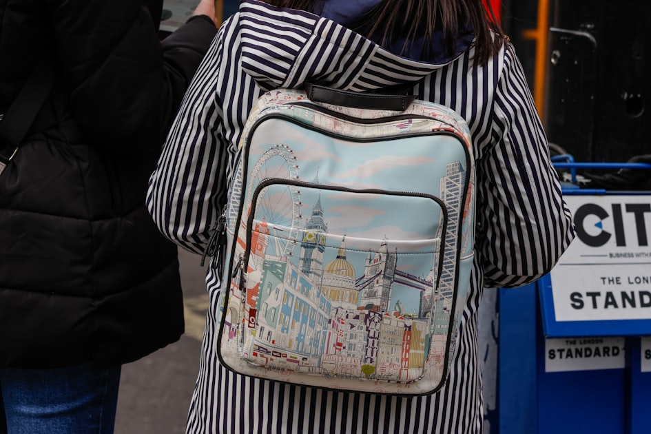 A person with a london-themed backpack.