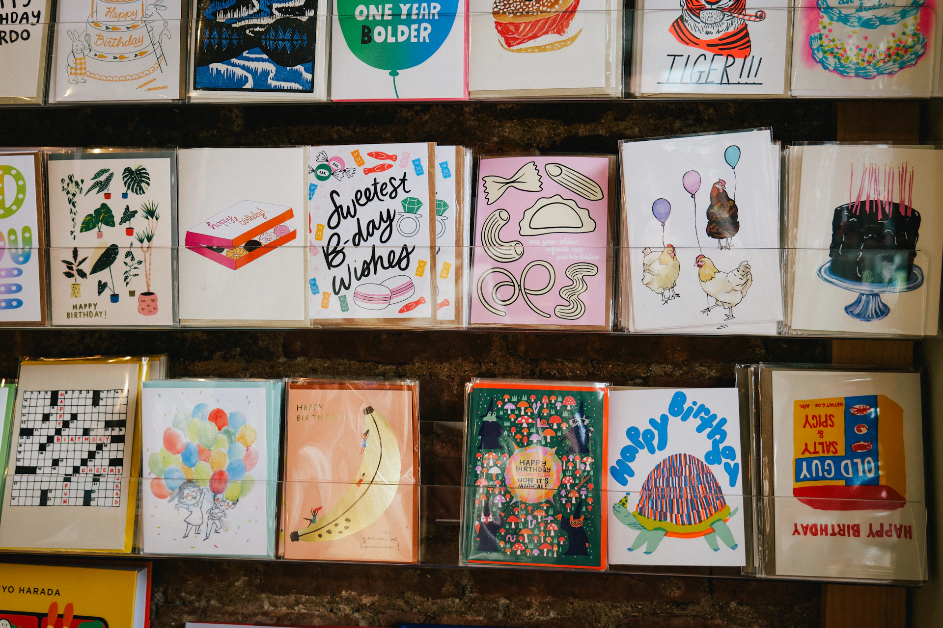 Greeting cards are displayed on shelves.