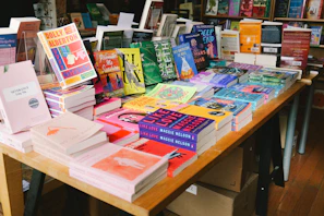 Books neatly arranged on a table in a bookstore