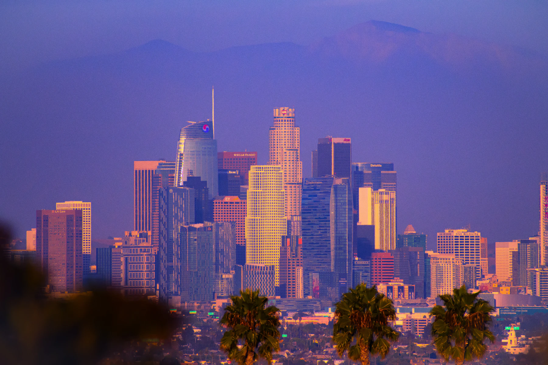 Los Angeles skyline against a colorful sunset sky